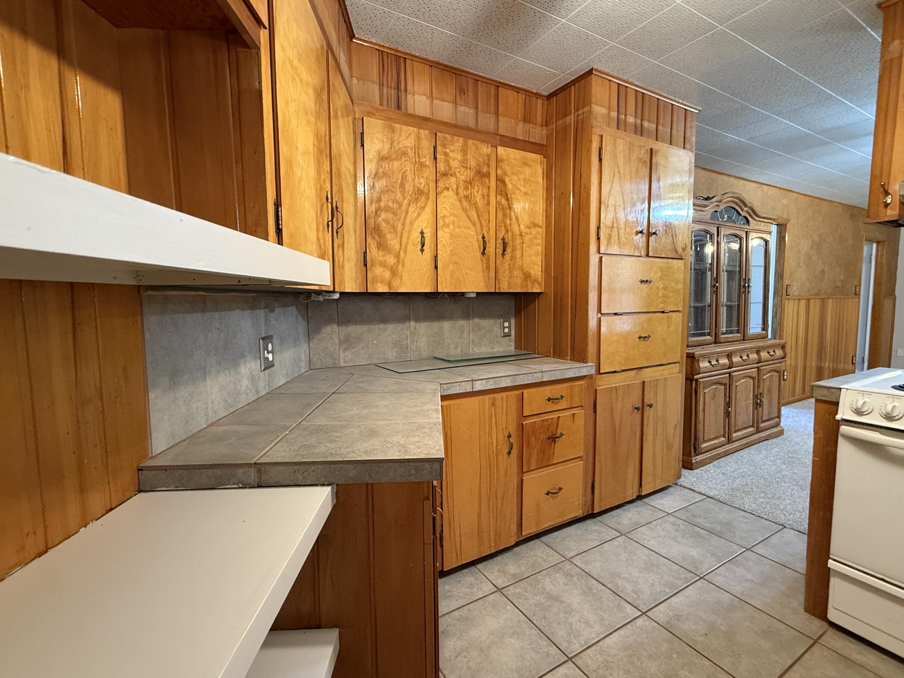 3391 Fisher Road Levelland, TX 79336 - Photo 13 of 47 a kitchen with stainless steel appliances granite countertop a sink and a refrigerator