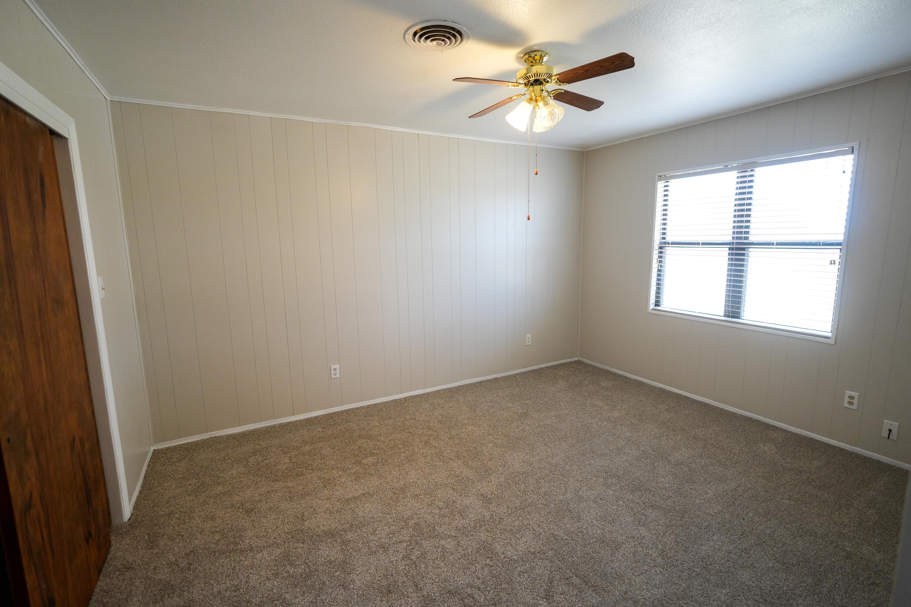 3391 Fisher Road Levelland, TX 79336 - Photo 27 of 47 an empty room with a window and a fan