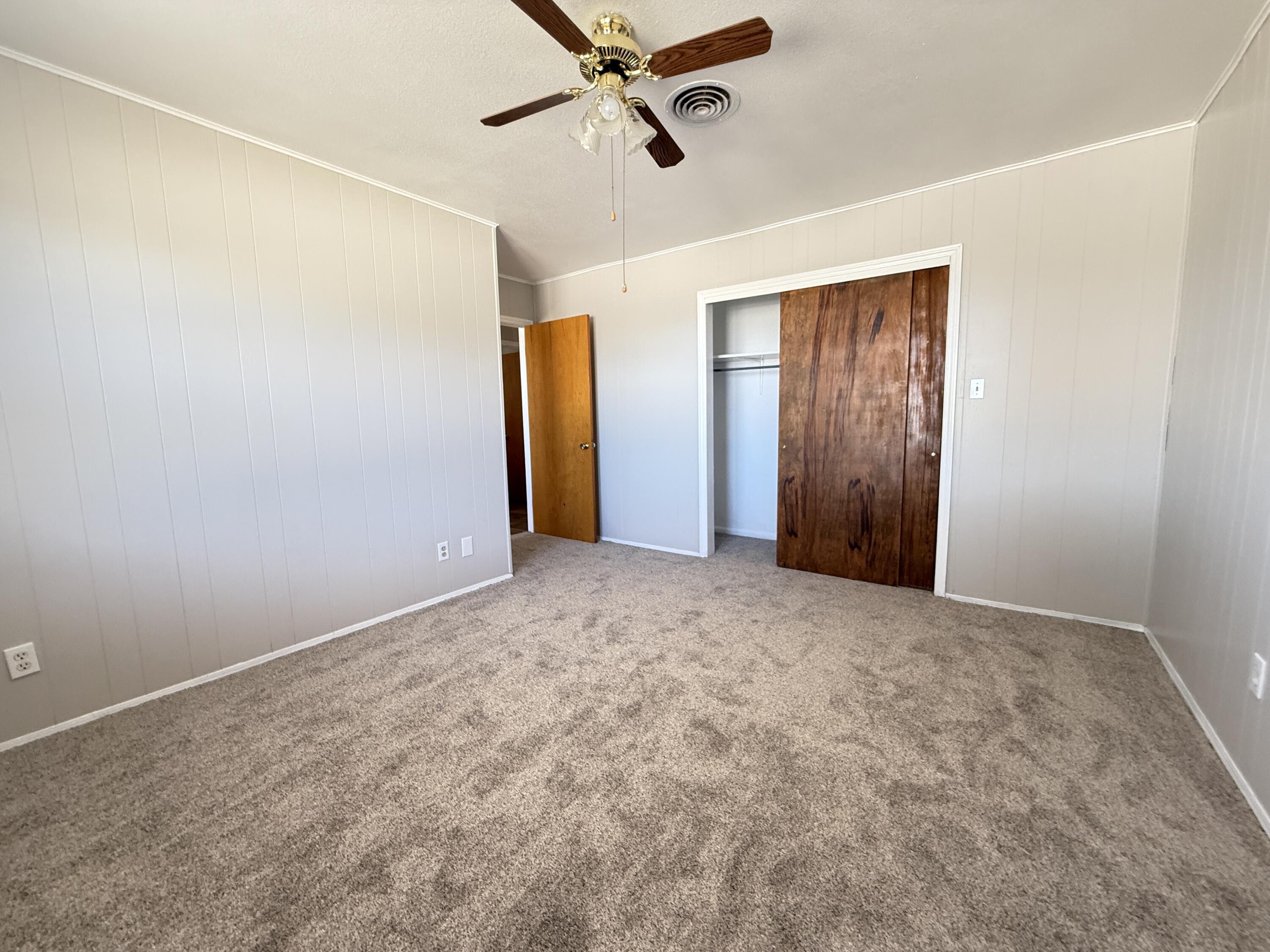 3391 Fisher Road Levelland, TX 79336 - Photo 31 of 47 an empty room with closet and windows