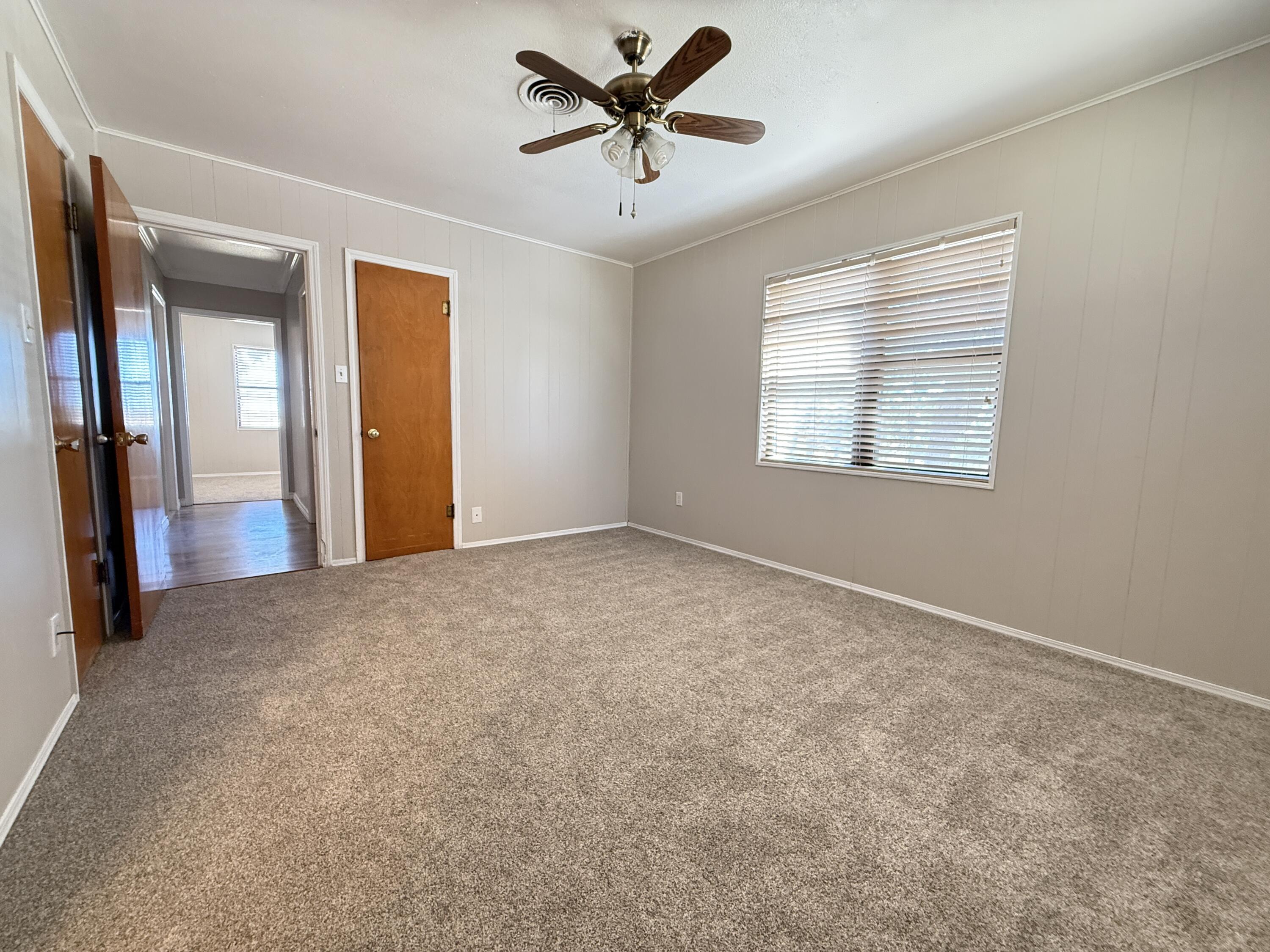 3391 Fisher Road Levelland, TX 79336 - Photo 35 of 47 a view of a livingroom with a ceiling fan and window