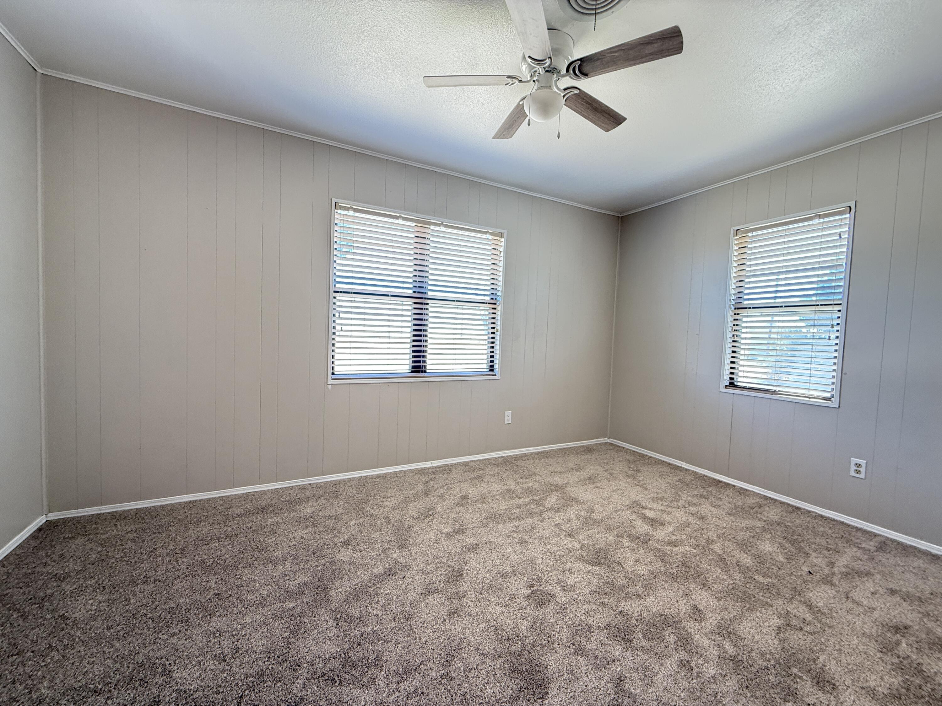 3391 Fisher Road Levelland, TX 79336 - Photo 36 of 47 a view of room with a ceiling fan and window
