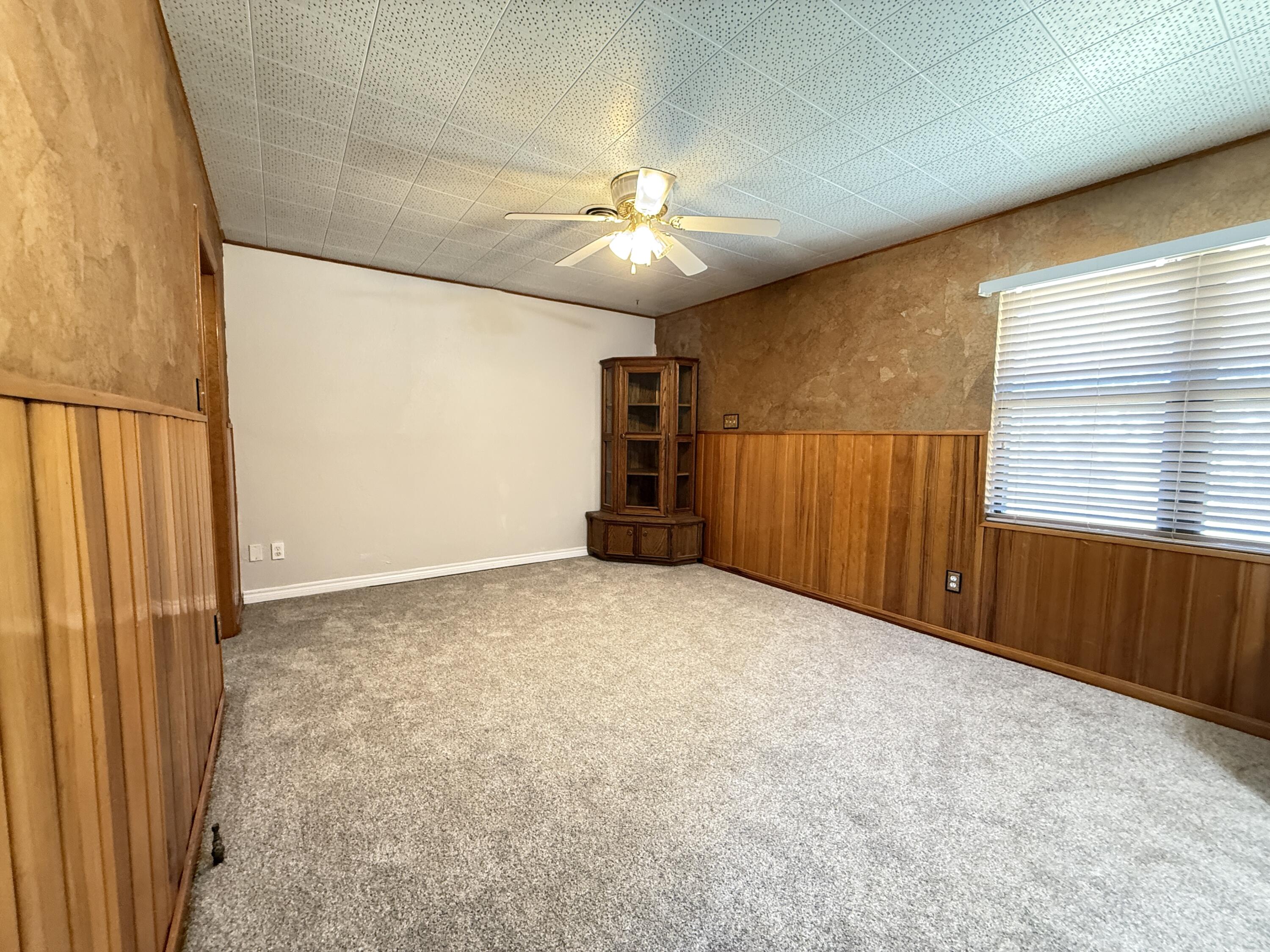 3391 Fisher Road Levelland, TX 79336 - Photo 9 of 47 wooden floor in an empty room