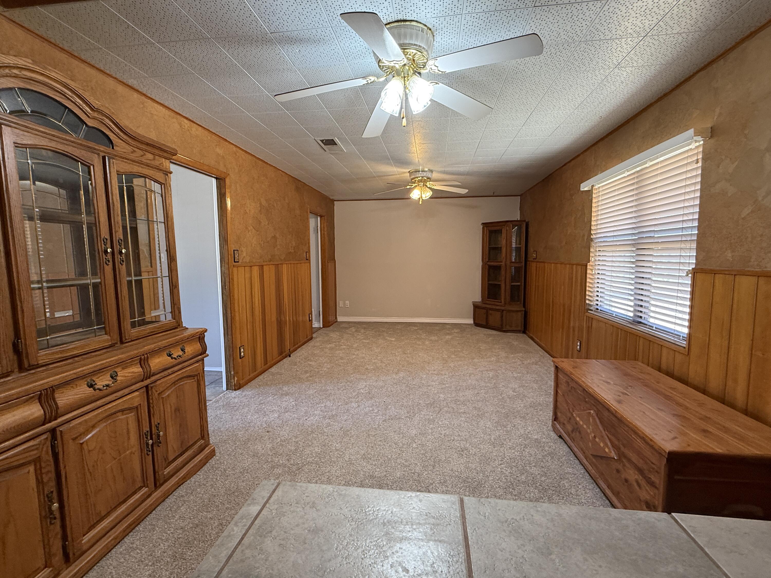 3391 Fisher Road Levelland, TX 79336 - Photo 10 of 47 a view of an empty room with a window