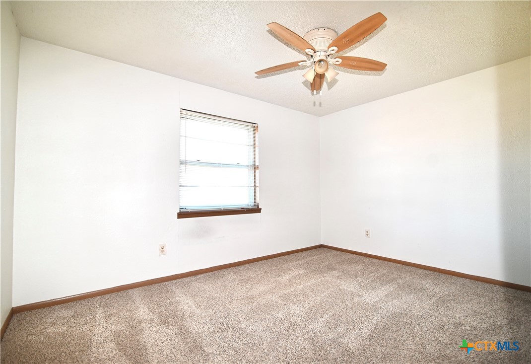 928 Randa Street Copperas Cove, TX 76522 - Photo 7 of 19 an empty room with windows and fan