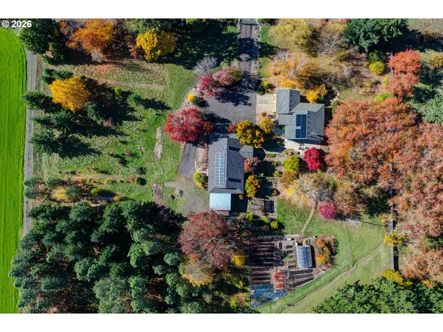 a view of a house with a yard and garden