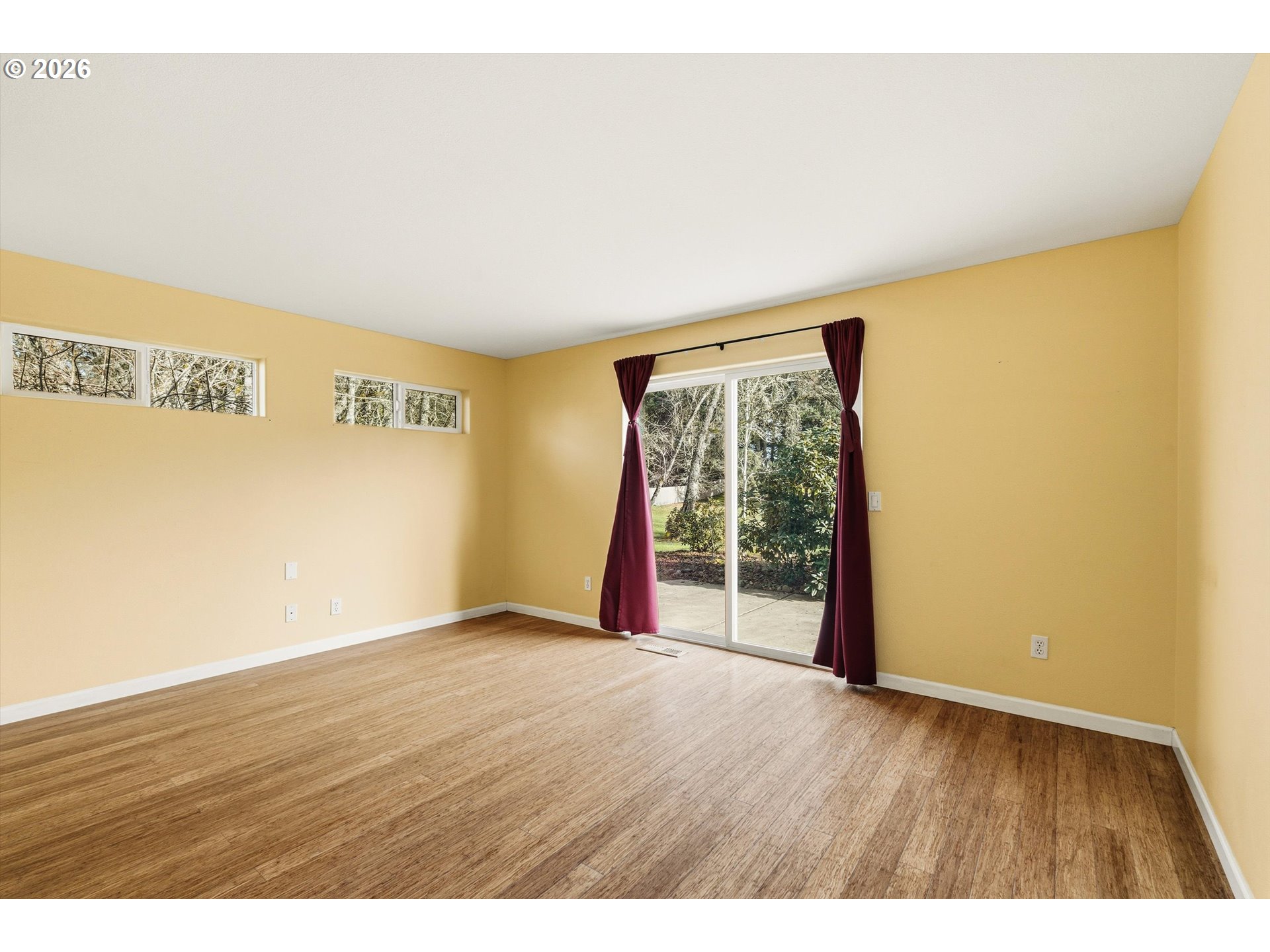 30303 Bellfountain Road Corvallis, OR 97333 - Photo 17 of 47 a view of an empty room with wooden floor and a window