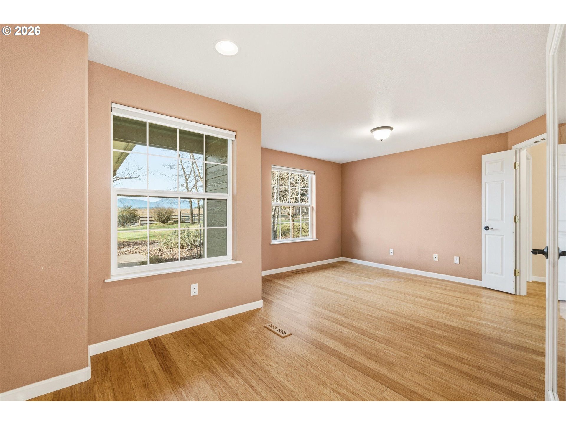30303 Bellfountain Road Corvallis, OR 97333 - Photo 29 of 47 a view of an empty room with wooden floor and a window
