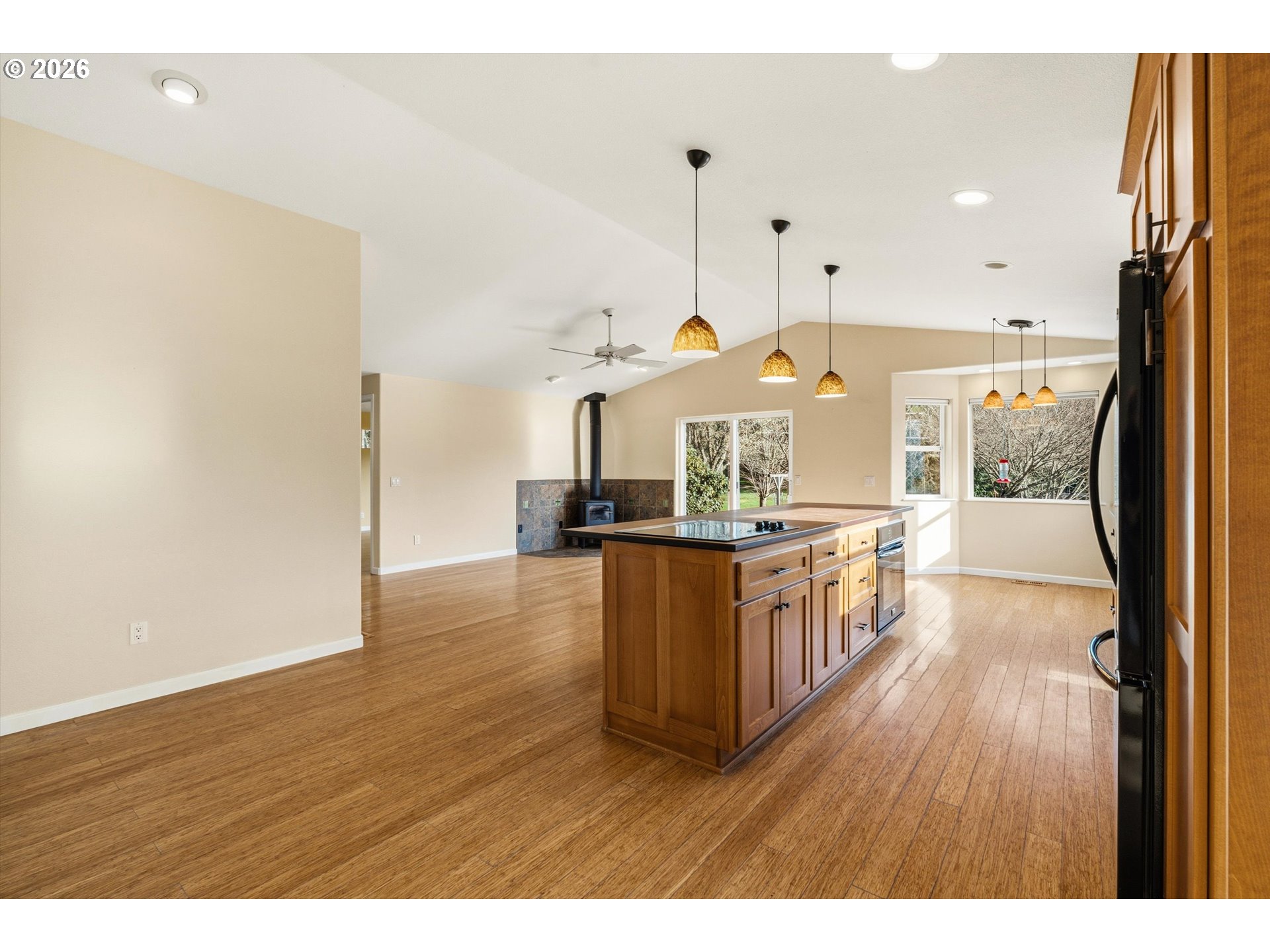 30303 Bellfountain Road Corvallis, OR 97333 - Photo 9 of 47 a kitchen with stainless steel appliances granite countertop a stove a sink a refrigerator a center island and wooden floor