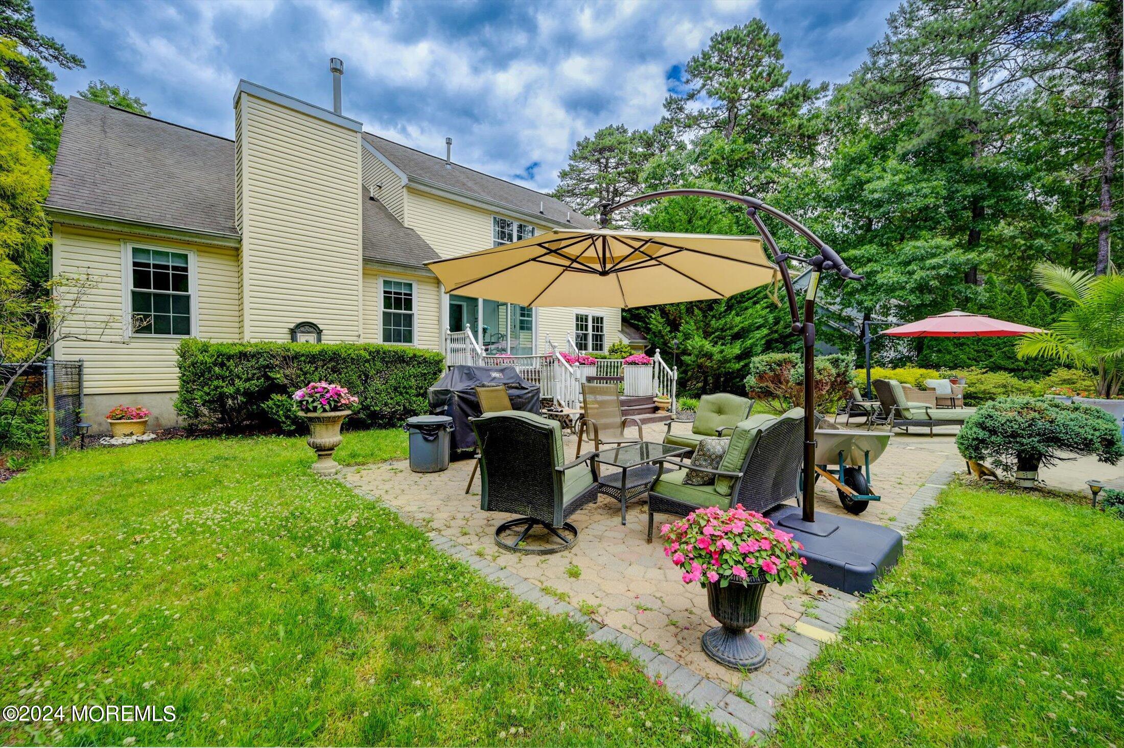 227 East Pleasant Grove Road Jackson, NJ 08527 - Photo 38 of 53 a view of a backyard with sitting area and furniture