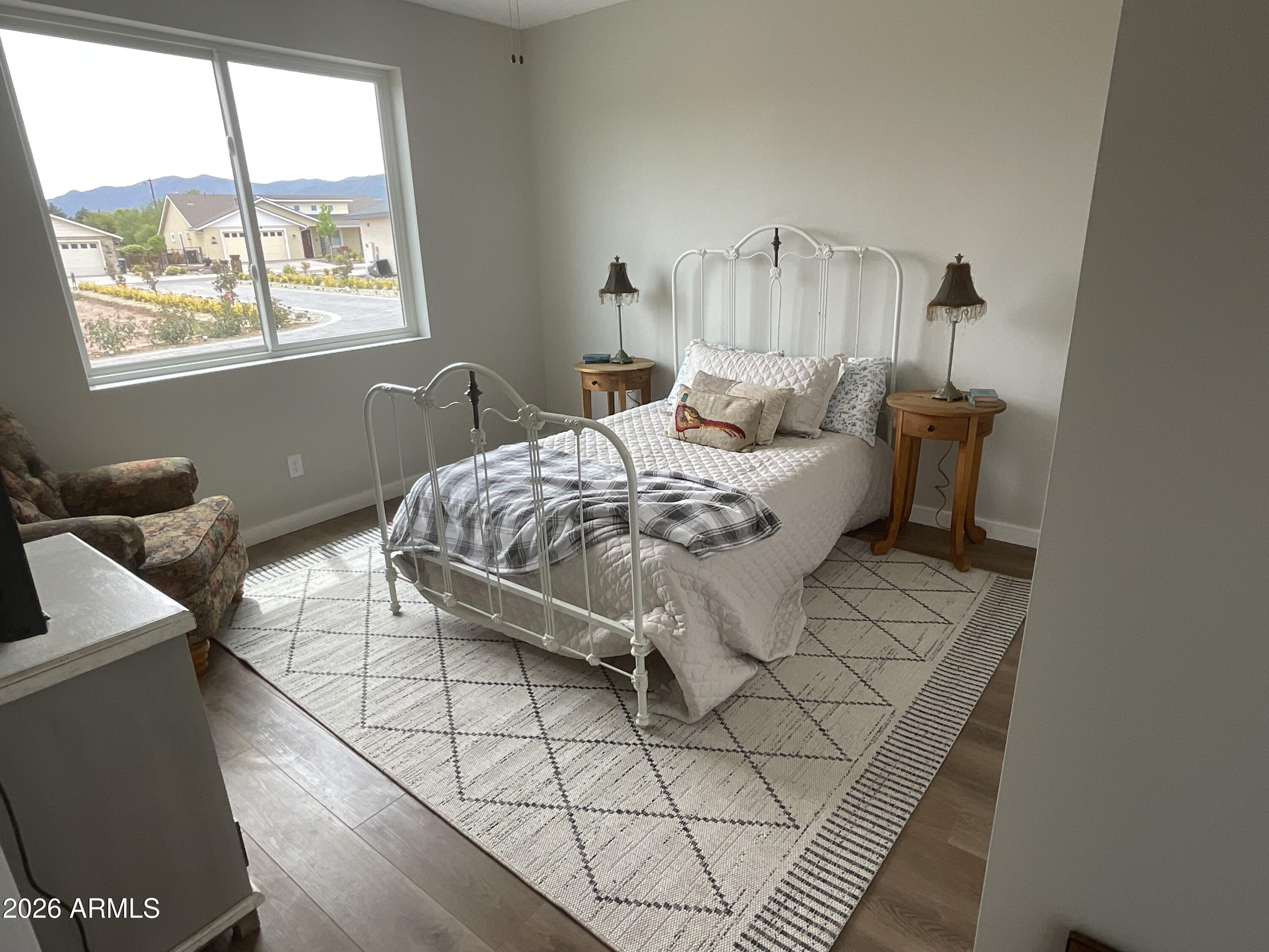 498 Kindra Heights Road Cottonwood, AZ 86326 - Photo 15 of 37 a bedroom with a bed and a window