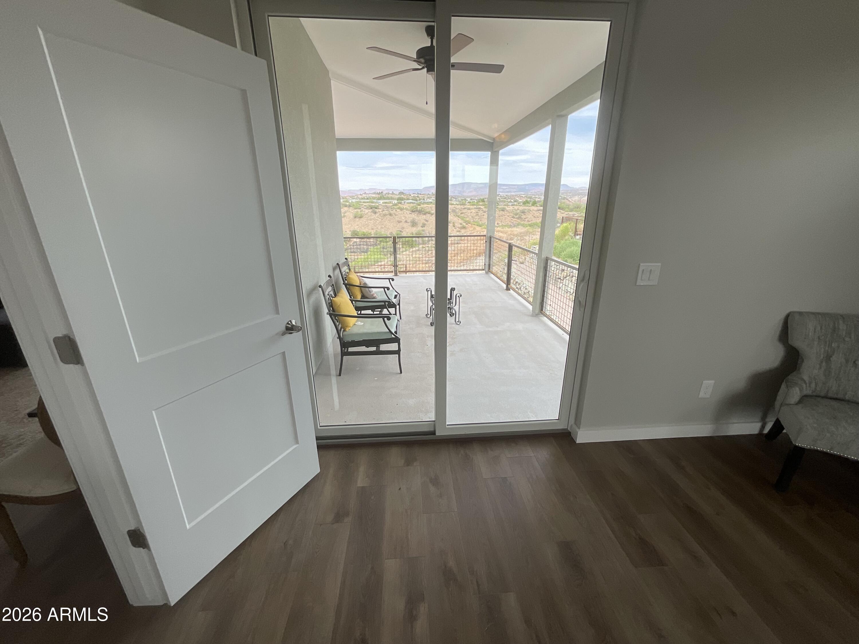 498 Kindra Heights Road Cottonwood, AZ 86326 - Photo 16 of 37 a view of room with window and wooden floor