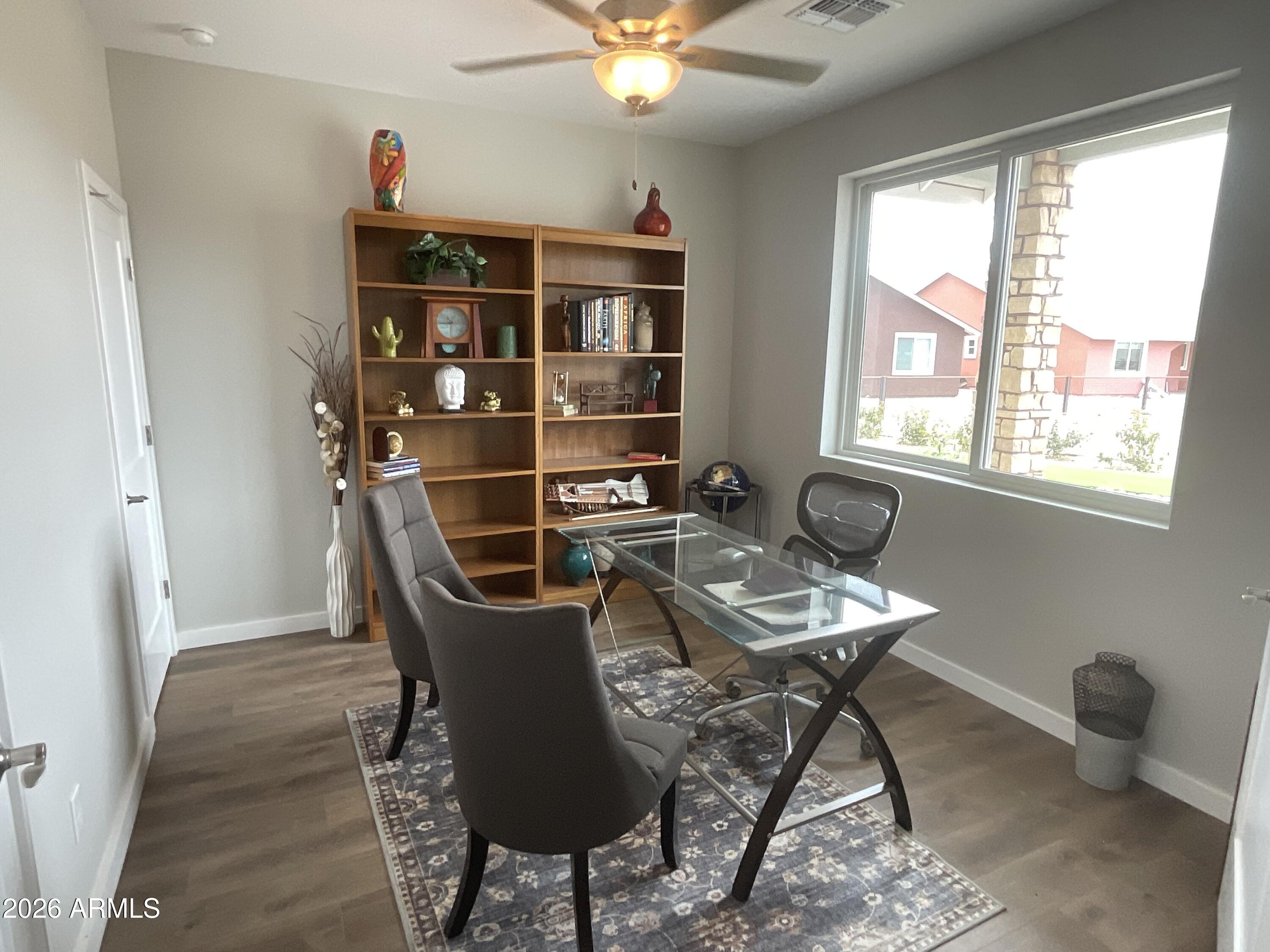 498 Kindra Heights Road Cottonwood, AZ 86326 - Photo 17 of 37 a view of a workspace with furniture and a window