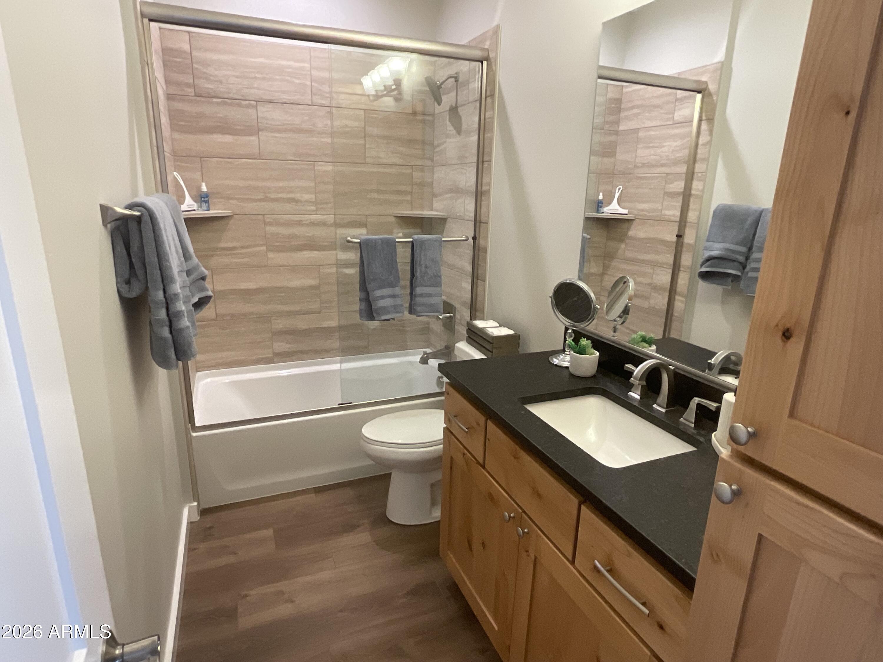 498 Kindra Heights Road Cottonwood, AZ 86326 - Photo 21 of 37 a bathroom with a sink a toilet and shower