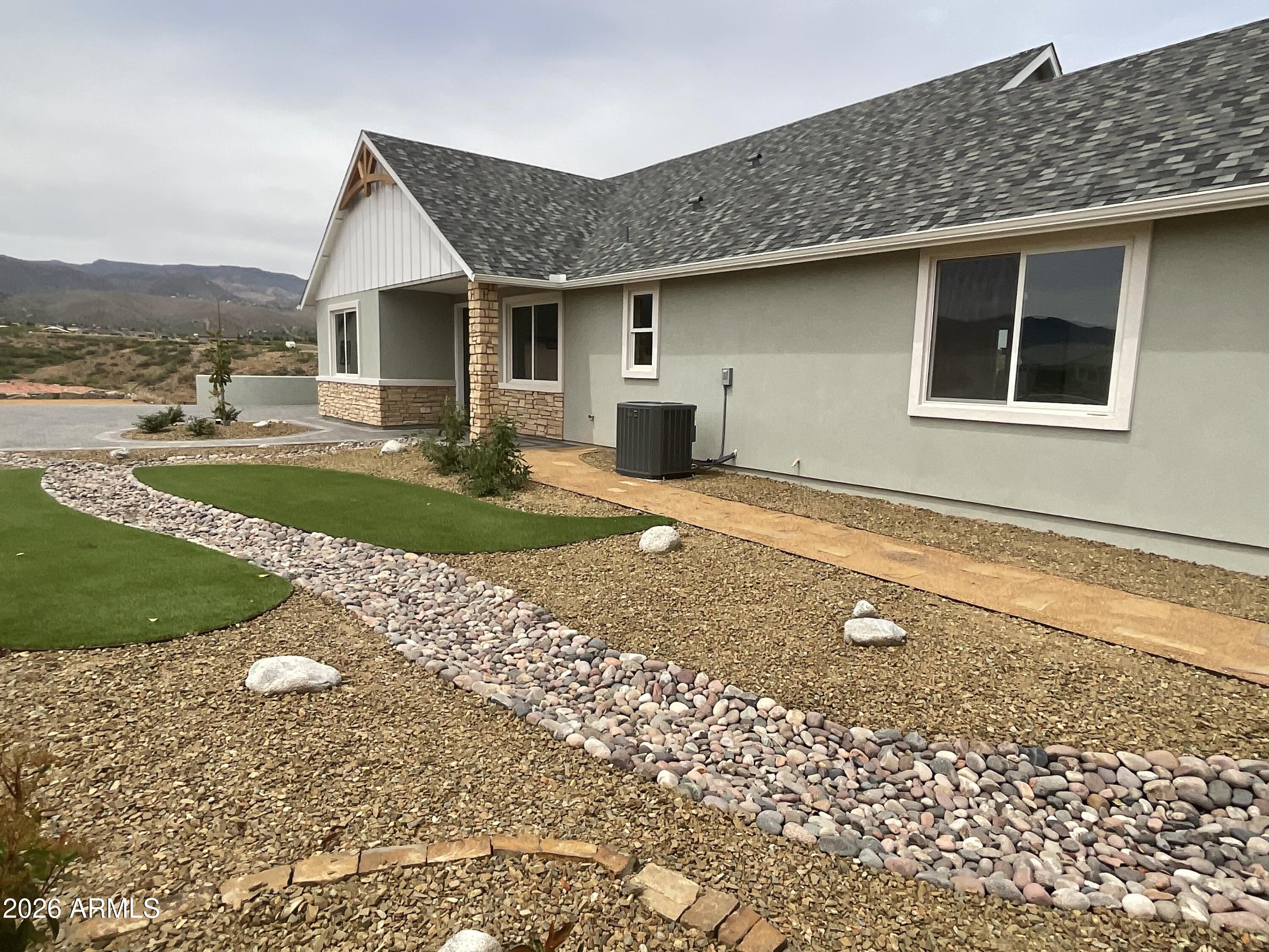 498 Kindra Heights Road Cottonwood, AZ 86326 - Photo 22 of 37 a front view of a house with a yard