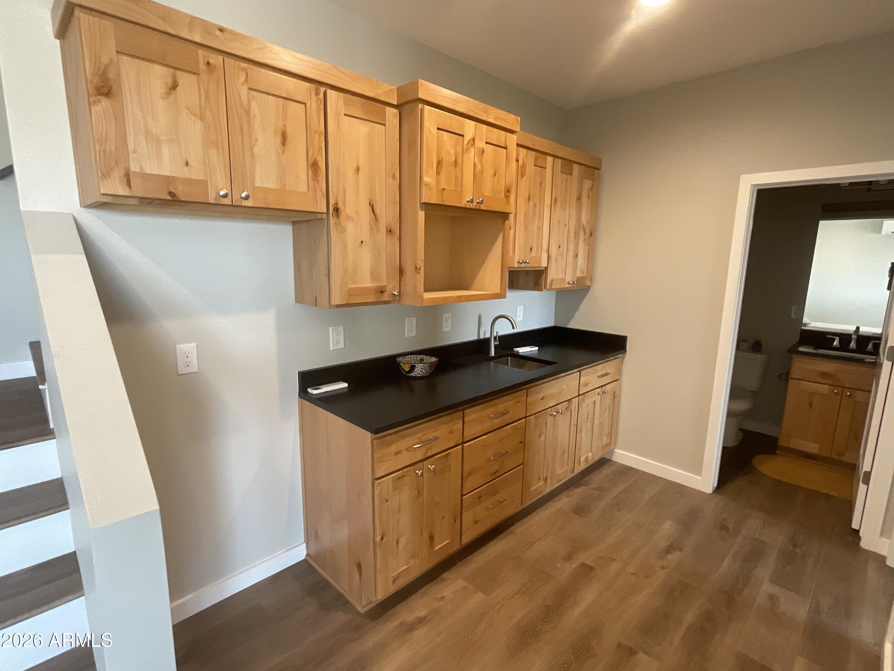 498 Kindra Heights Road Cottonwood, AZ 86326 - Photo 24 of 37 a kitchen with stainless steel appliances granite countertop a stove a sink and a refrigerator
