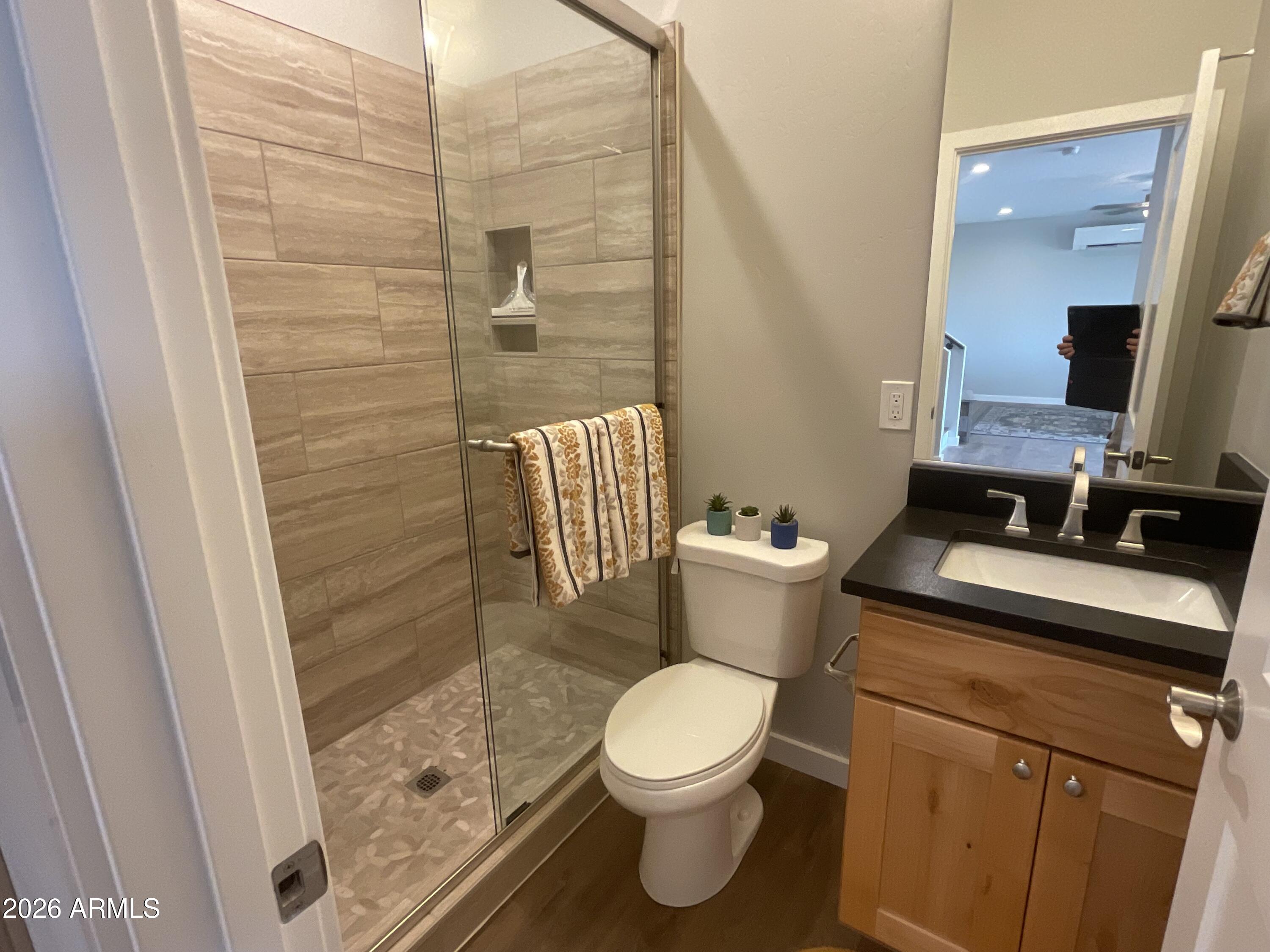 498 Kindra Heights Road Cottonwood, AZ 86326 - Photo 26 of 37 a bathroom with a toilet and a shower