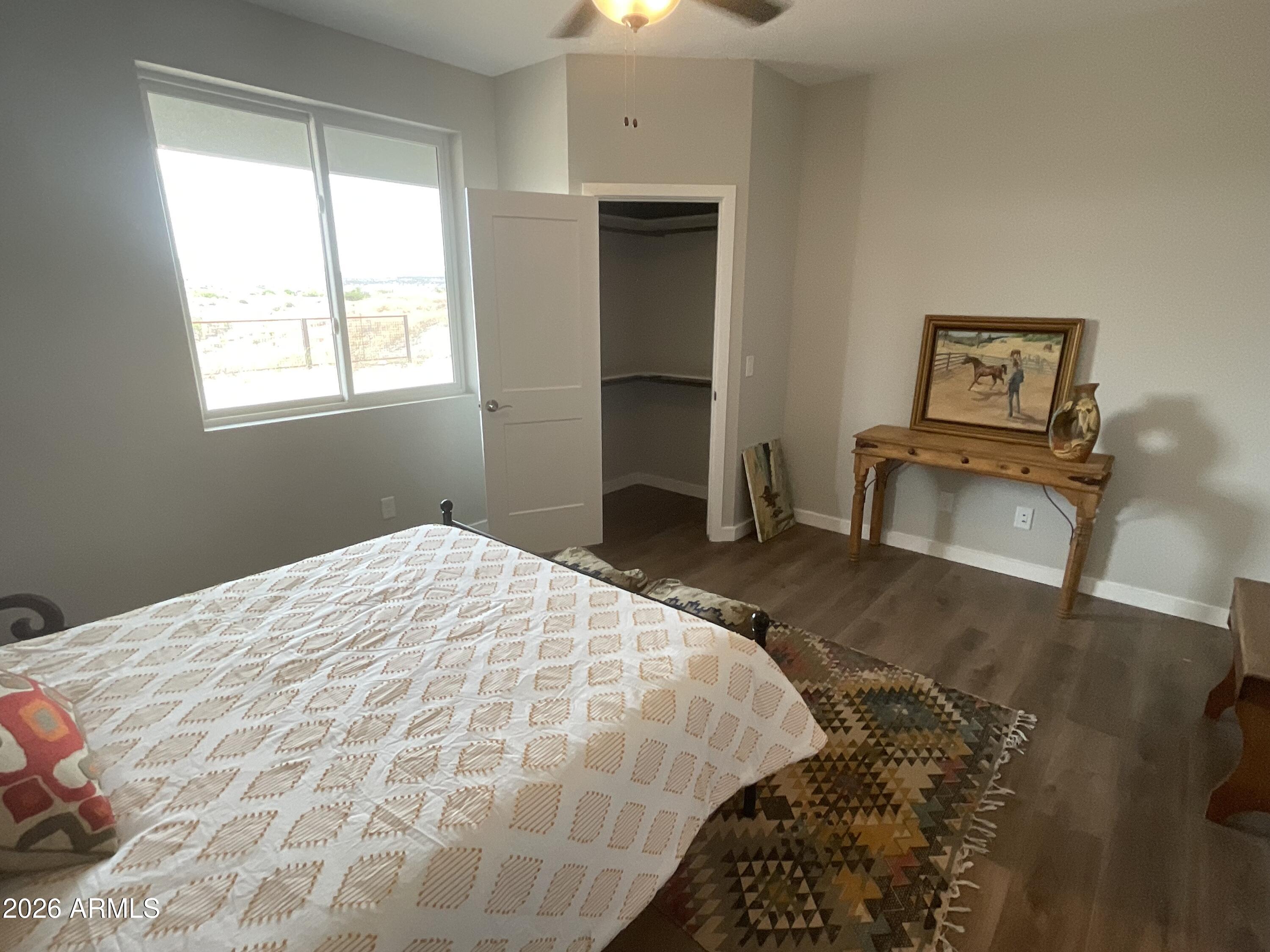 498 Kindra Heights Road Cottonwood, AZ 86326 - Photo 28 of 37 a bedroom with a bed and a window