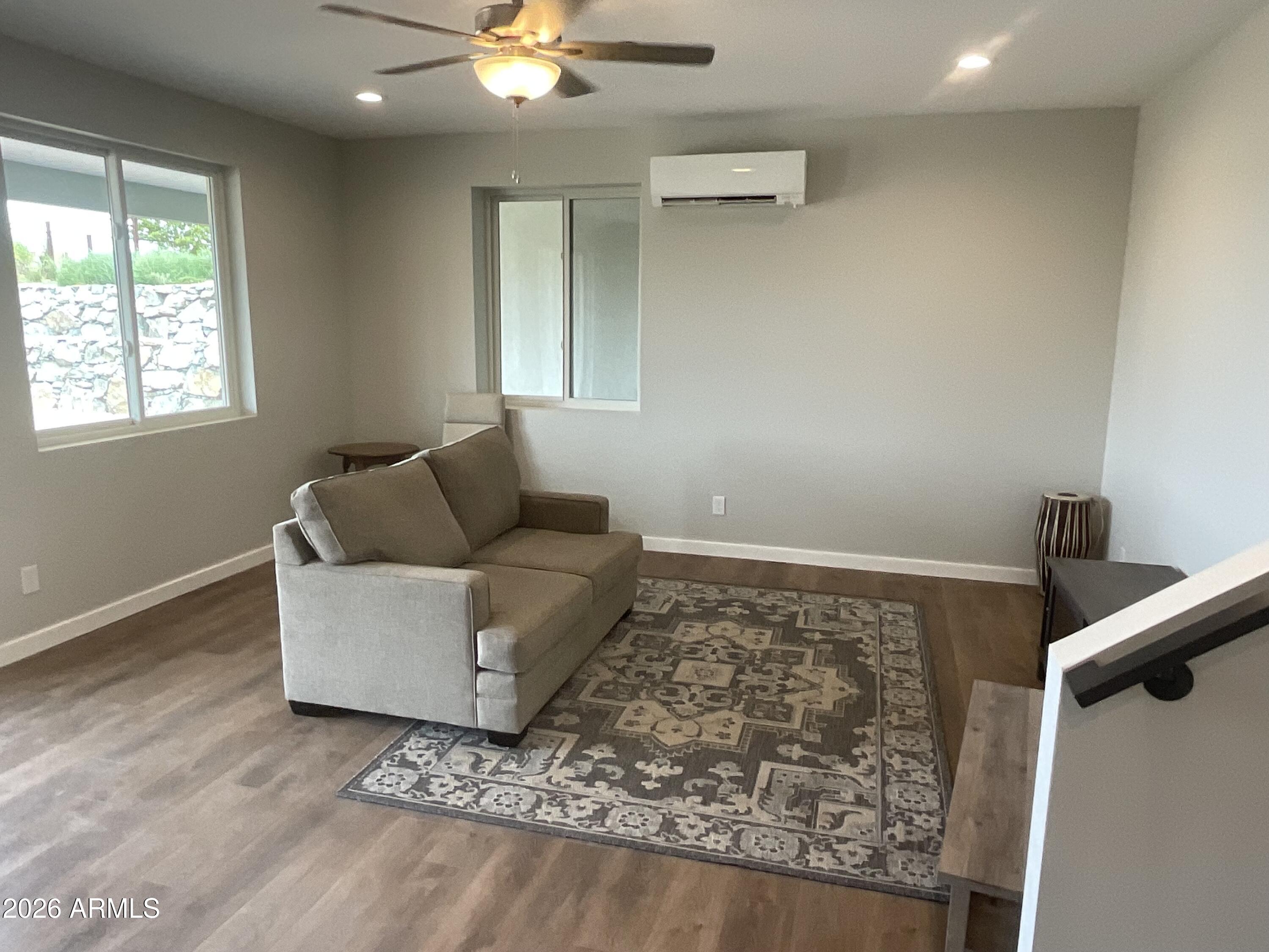 498 Kindra Heights Road Cottonwood, AZ 86326 - Photo 30 of 37 a living room with furniture and a rug