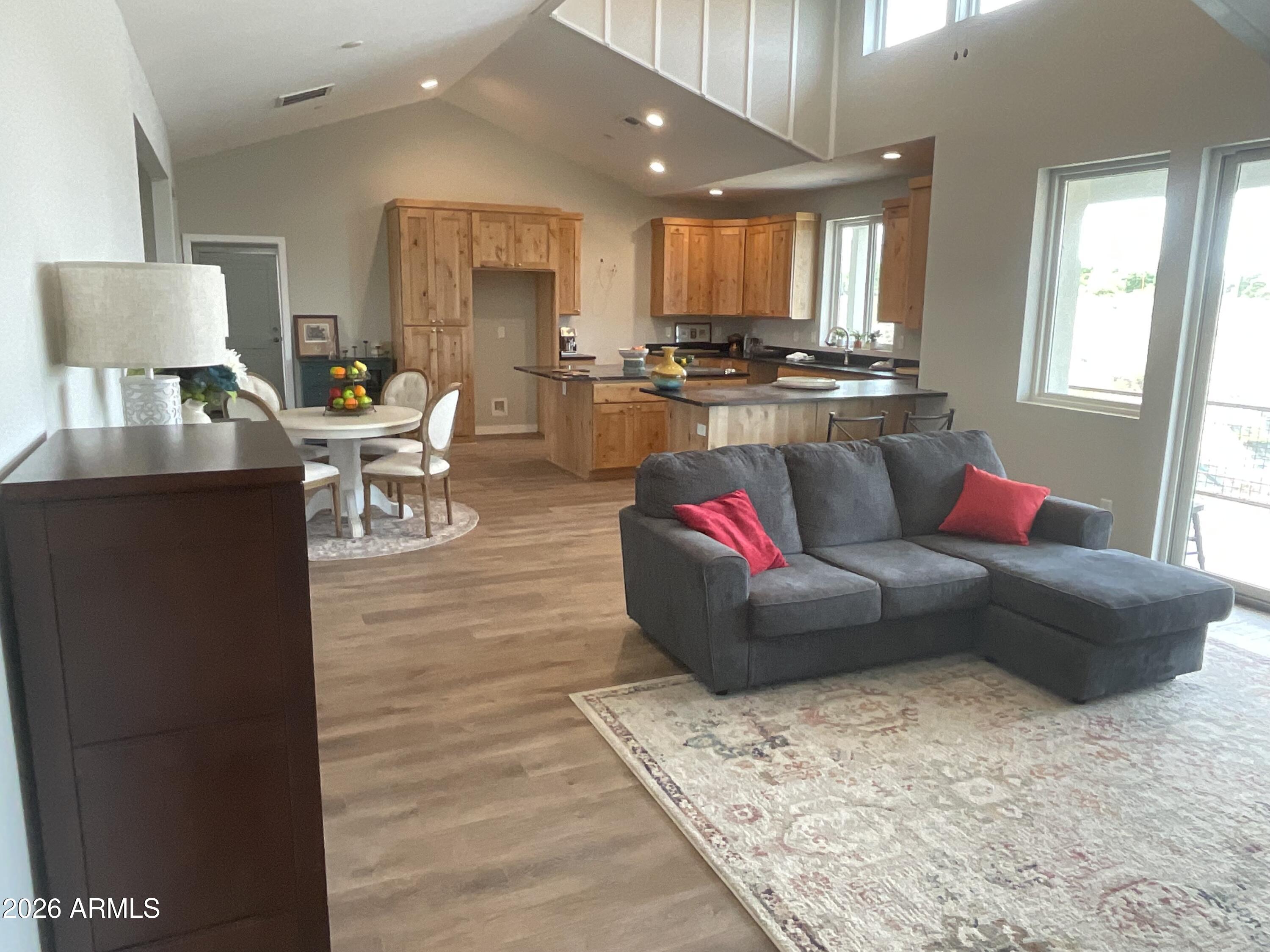498 Kindra Heights Road Cottonwood, AZ 86326 - Photo 3 of 37 a living room with furniture and kitchen view