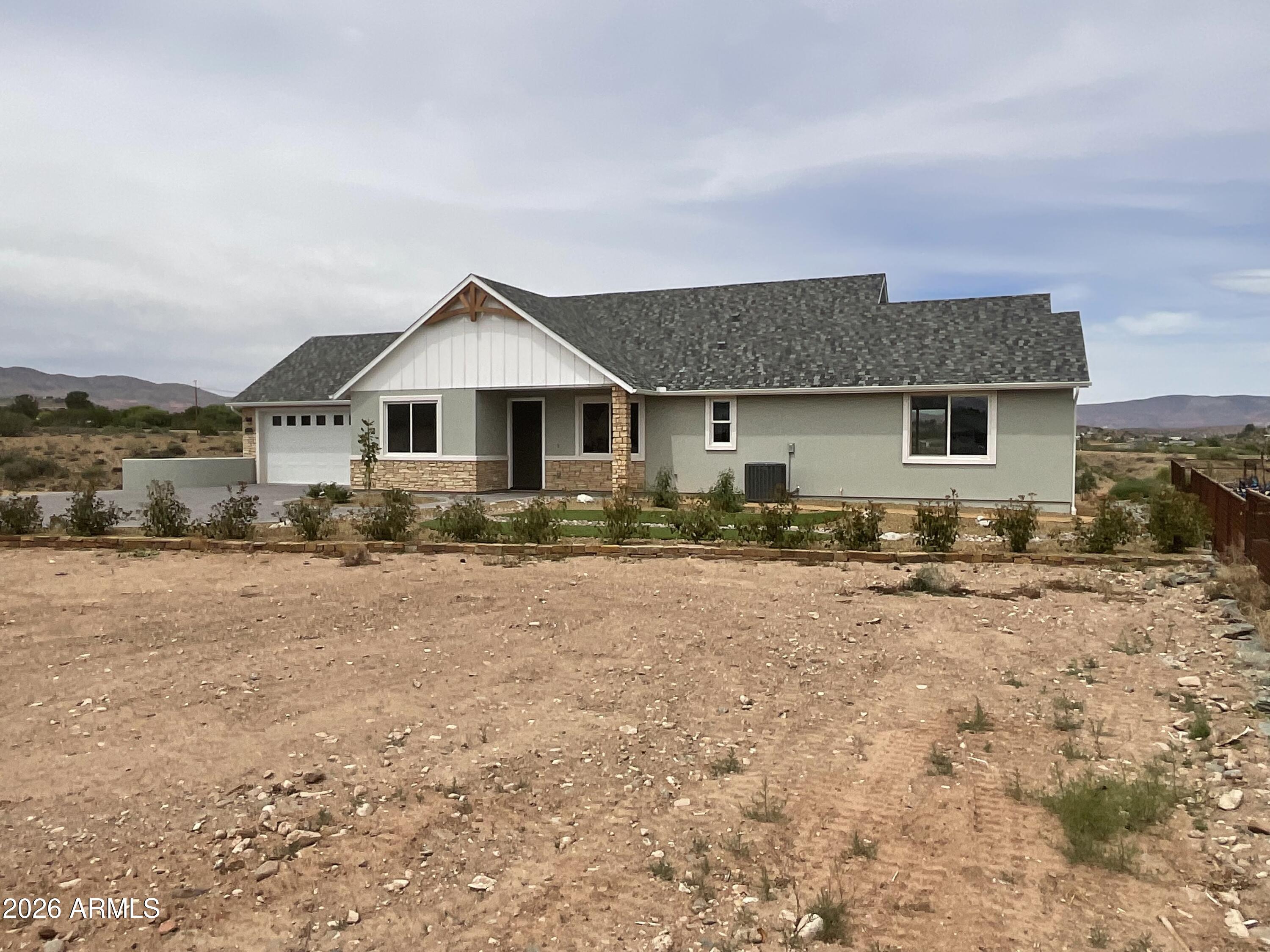 498 Kindra Heights Road Cottonwood, AZ 86326 - Photo 35 of 37 a front view of a house with a yard