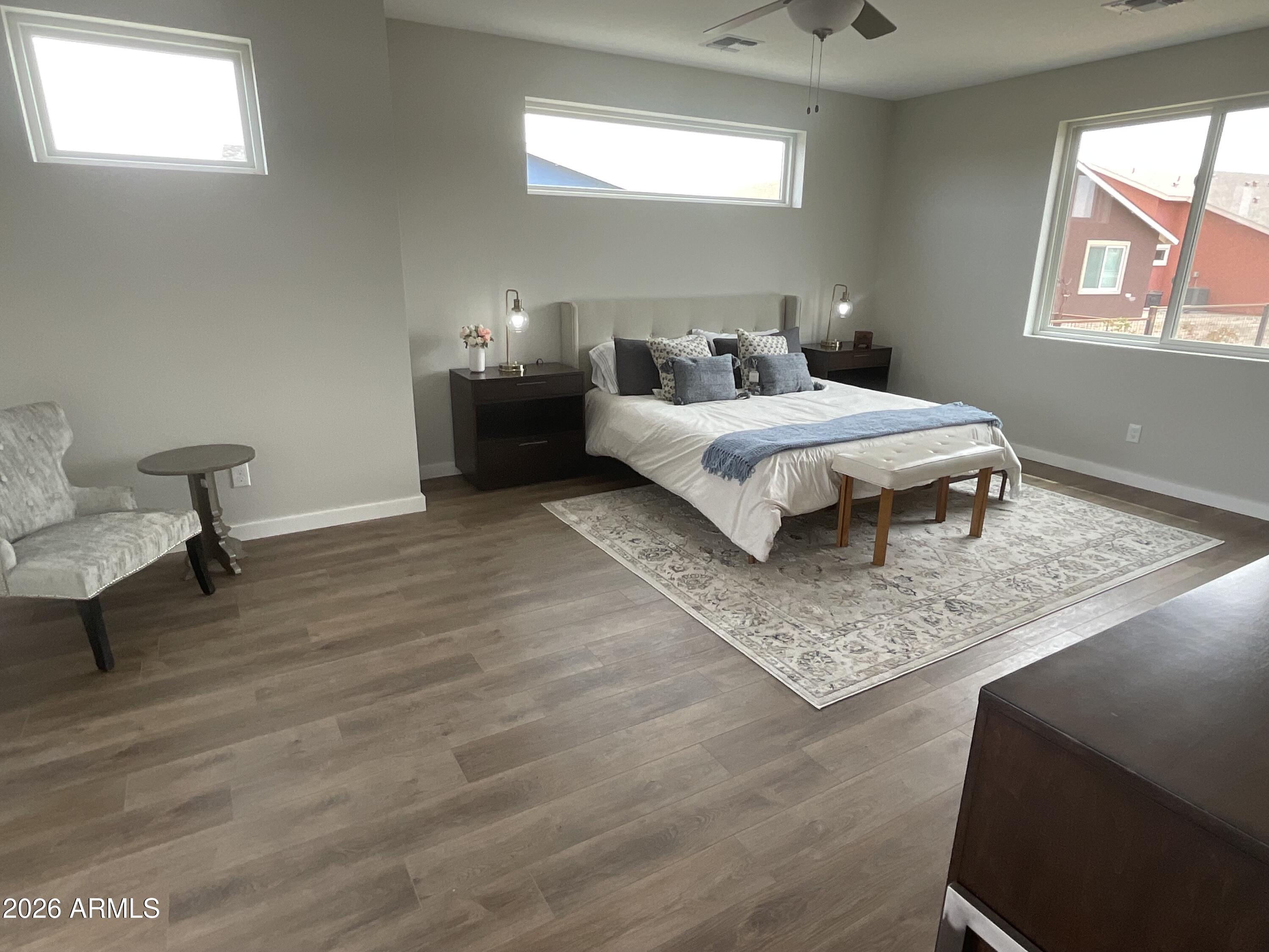 498 Kindra Heights Road Cottonwood, AZ 86326 - Photo 9 of 37 a bedroom with a bed and wooden floor