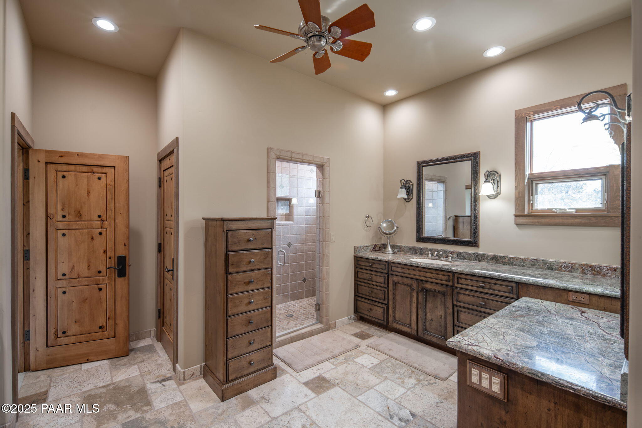 2158 Forest Mountain Road Prescott, AZ 86303 - Photo 29 of 68 a spacious bathroom with a granite countertop sink and a mirror
