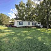 a view of a house with a big yard