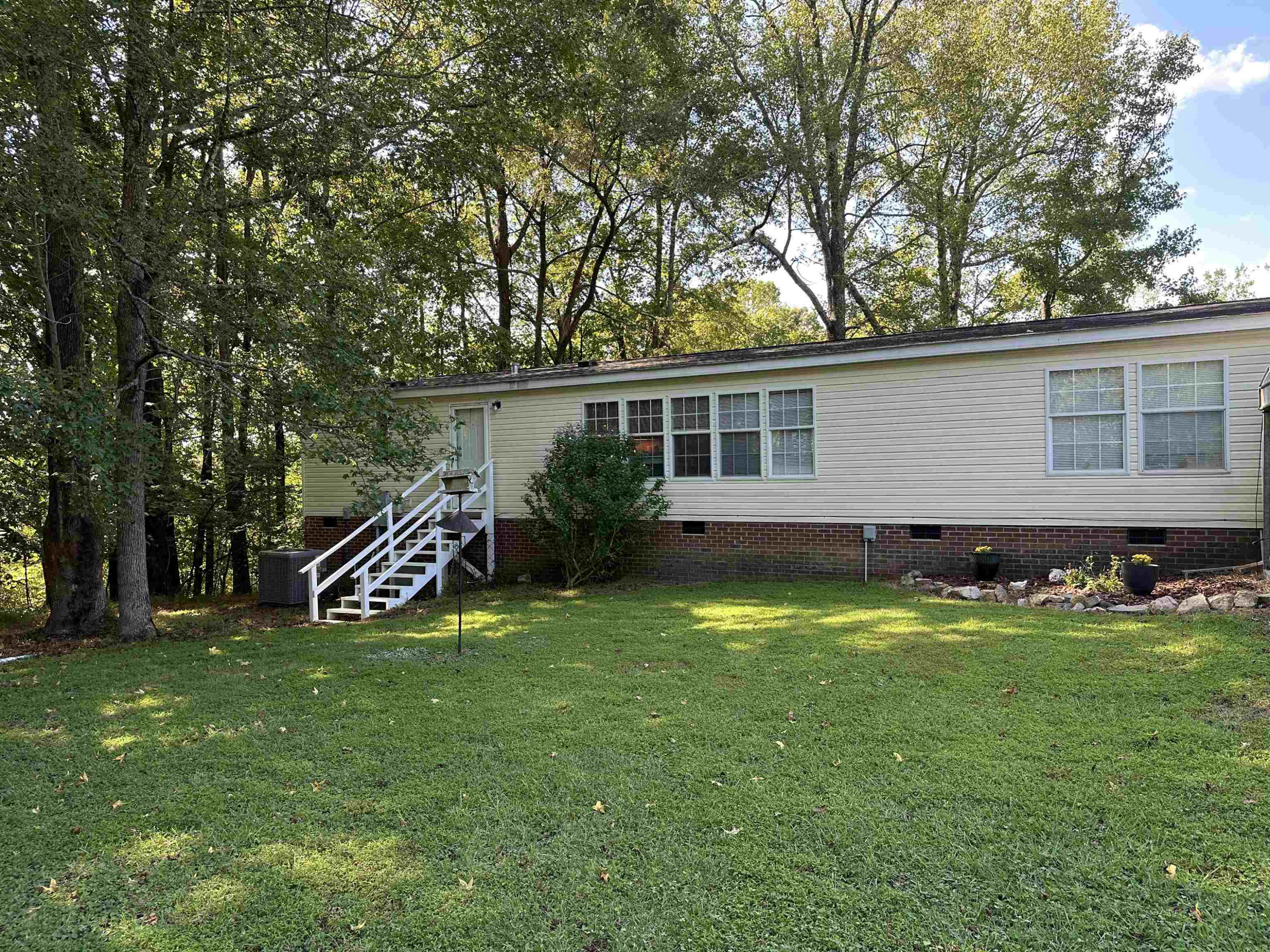 2048 Stoneridge Drive Stem, NC 27581 - Photo 3 of 6 a view of a house with backyard and sitting area