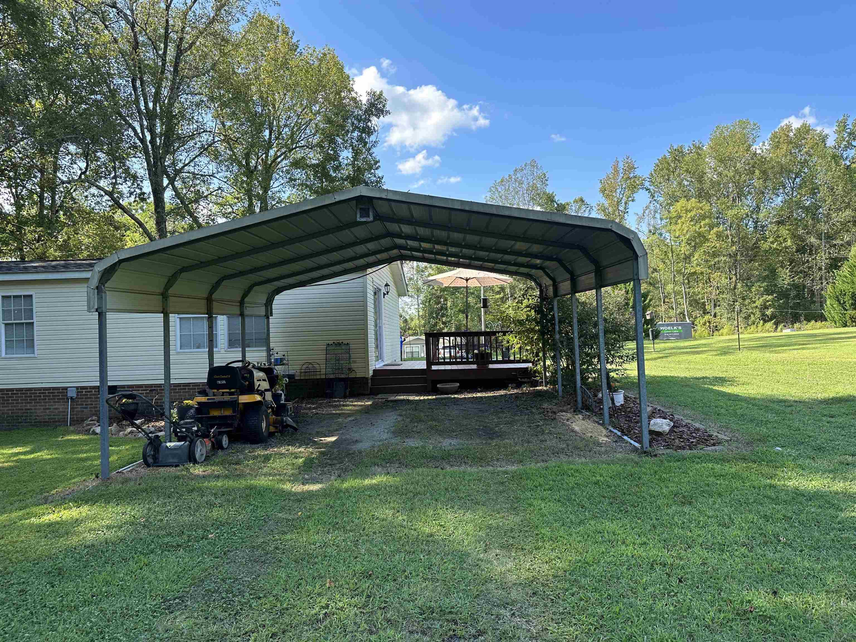 2048 Stoneridge Drive Stem, NC 27581 - Photo 4 of 6 a view of outdoor space with table and chairs
