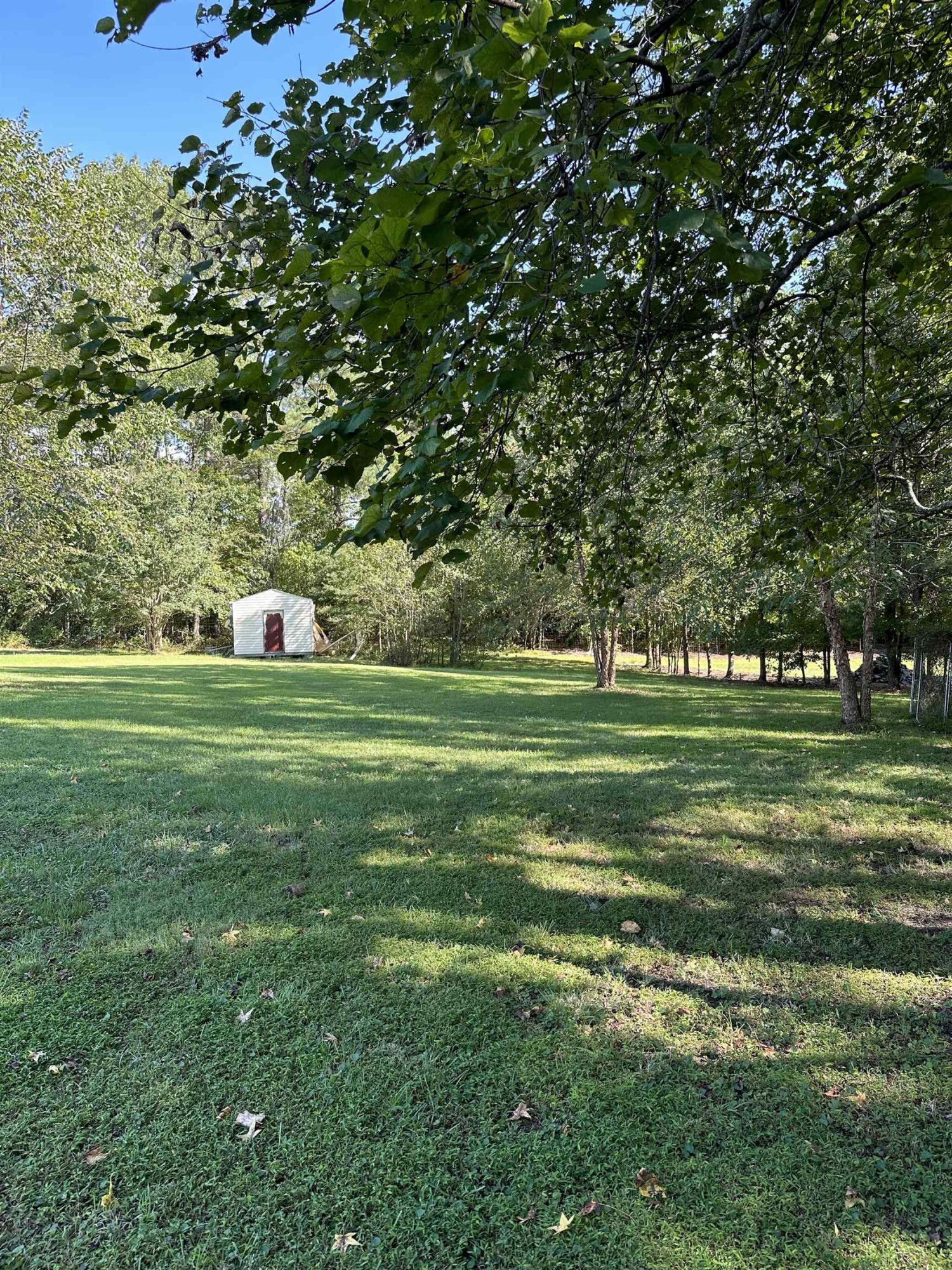 2048 Stoneridge Drive Stem, NC 27581 - Photo 6 of 6 a view of a golf course with a lake