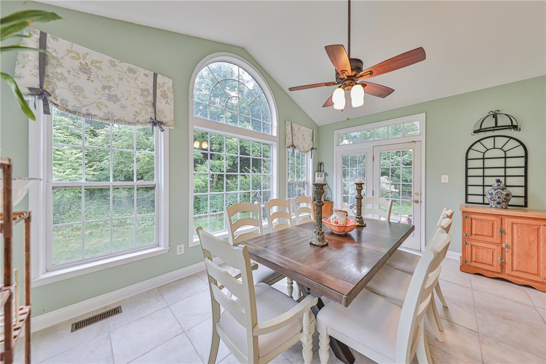 138 Clover Hollow Road Easton, PA 18045 - Photo 27 of 95 A well-lit dining area offers a seamless connection to the outdoors through abundant windows and French doors.
