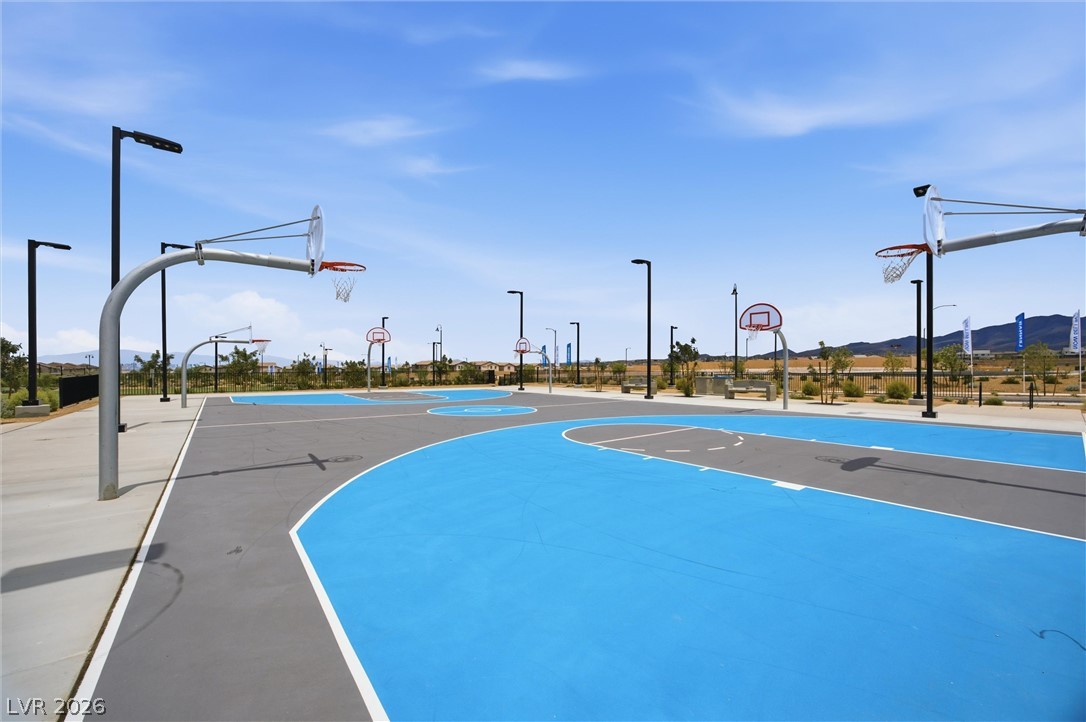 3705 Alla Rocca Avenue Henderson, NV 89044 - Photo 47 of 55 A vibrant community basketball court offers ample space for recreational play under an open sky.