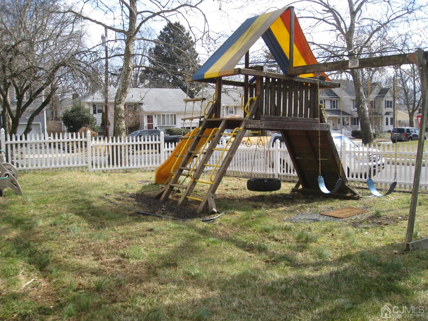 85 Willow Road Metuchen, NJ 08840 - Photo 18 of 21 Fenced yard with play gym