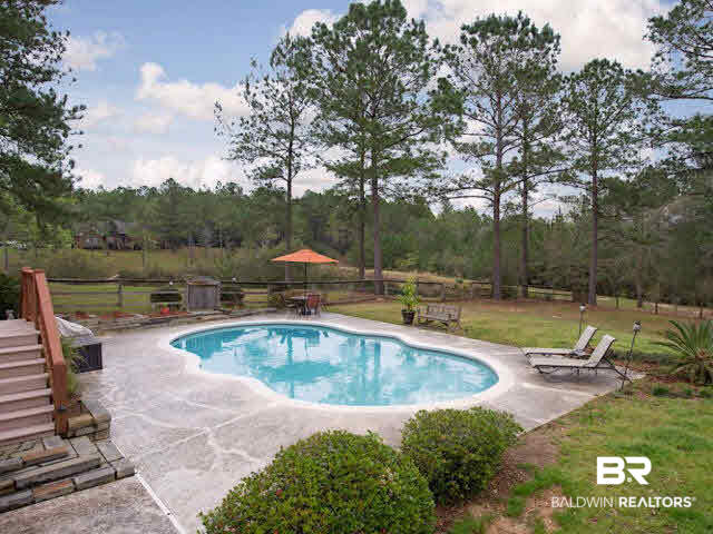 9380 Greenleaf Drive Daphne, AL 36527 - Photo 2 of 24 Plenty of Lounging Space in addition to back deck all around this gunite pool!