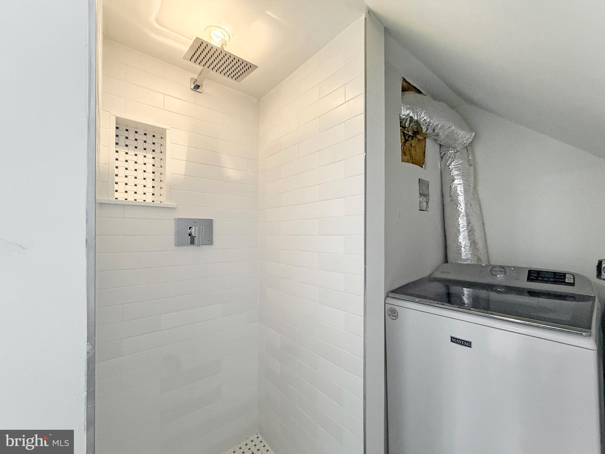 3216 18th Street Northeast Washington, DC 20018 - Photo 33 of 47 Compact laundry and shower space.