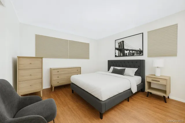 a bedroom with a bed and a dresser