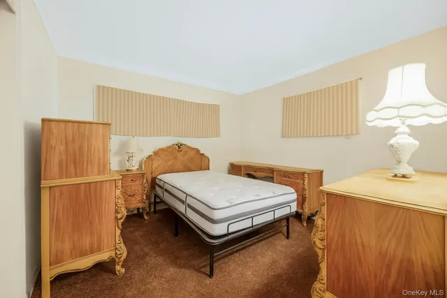 a bedroom with a bed and a table in it