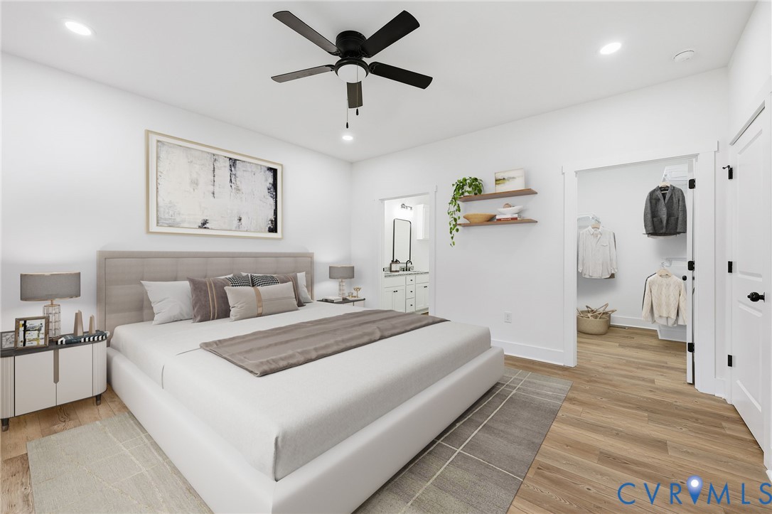 5888 Cartersville Road New Canton, VA 23123 - Photo 12 of 33 a bedroom with a large bed and a chandelier