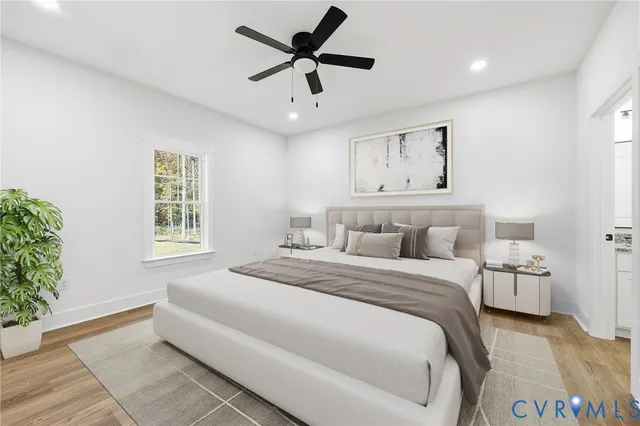 a spacious bedroom with a bed and a window