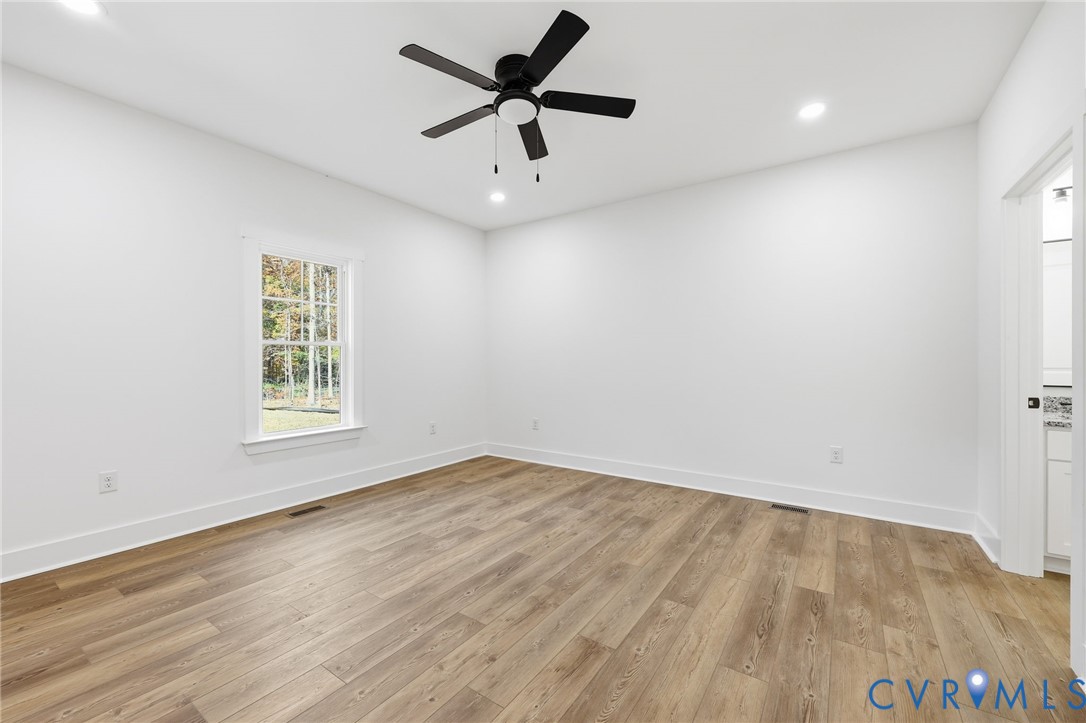 5888 Cartersville Road New Canton, VA 23123 - Photo 14 of 33 wooden floor in an empty room with a window