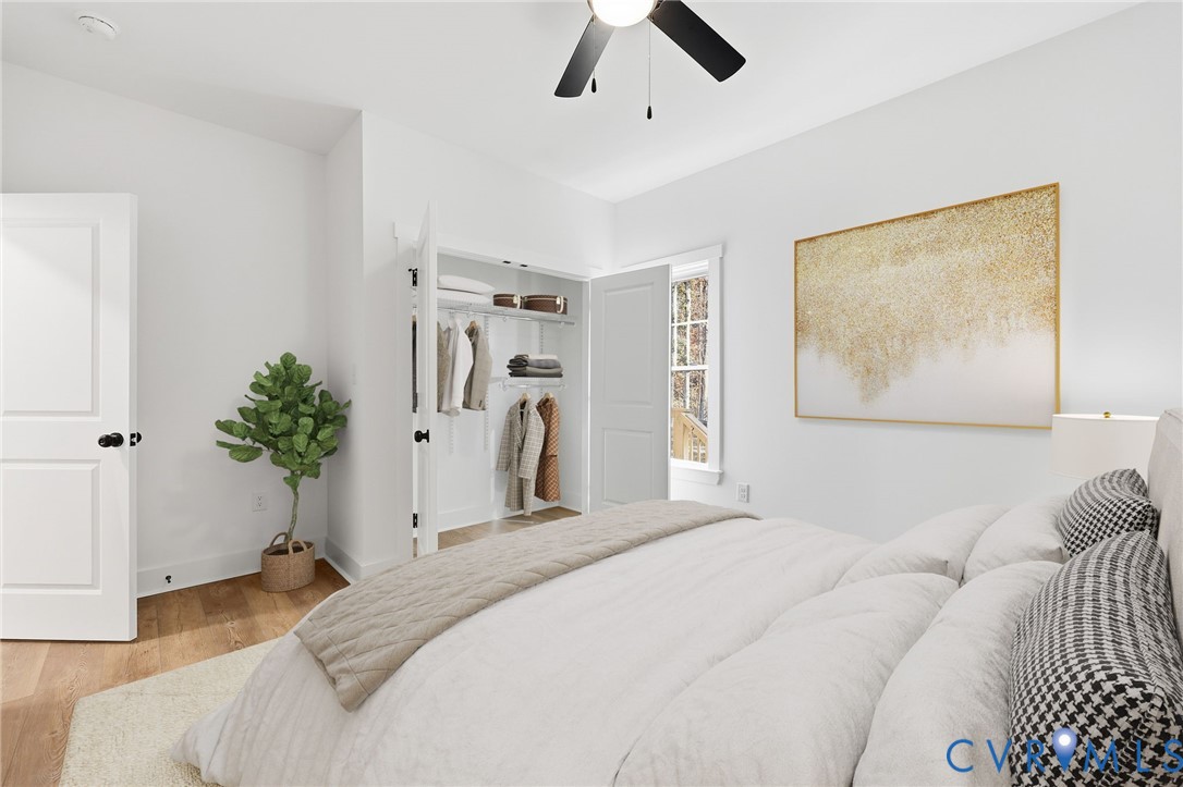 5888 Cartersville Road New Canton, VA 23123 - Photo 20 of 33 a bedroom with a bed and a chandelier