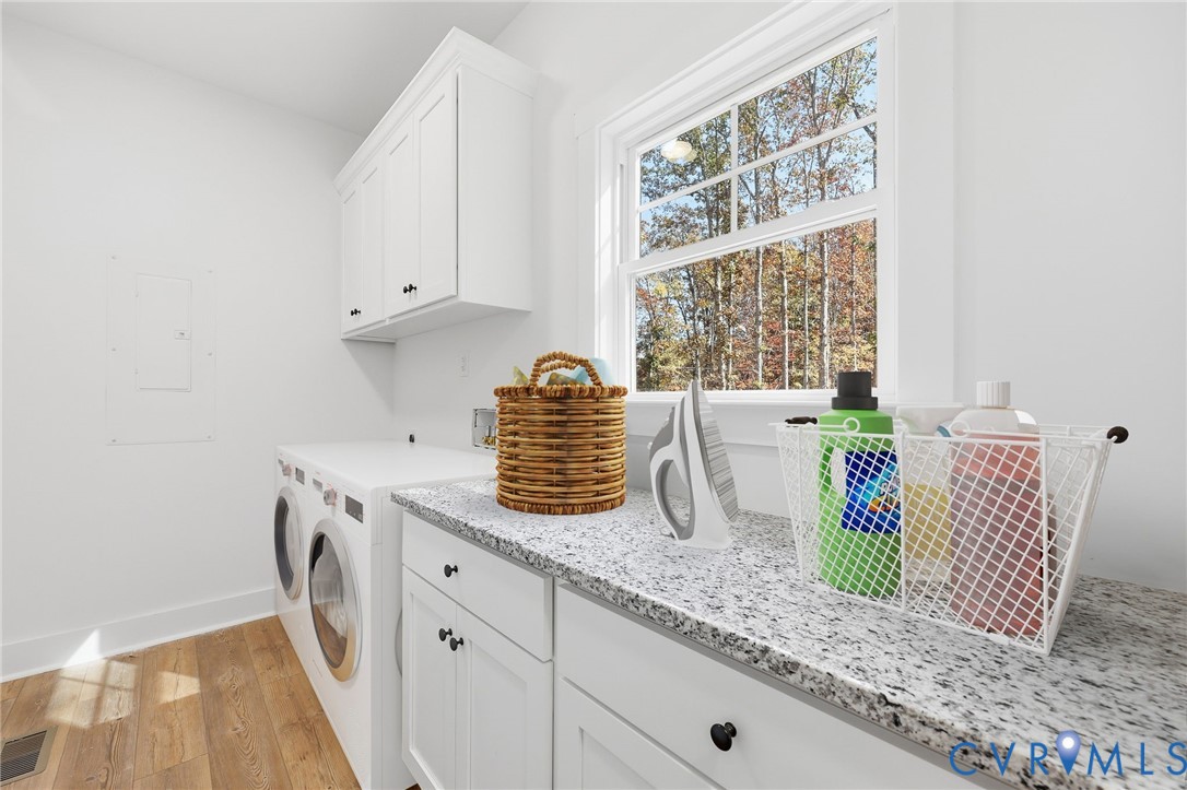 5888 Cartersville Road New Canton, VA 23123 - Photo 26 of 33 a kitchen with granite countertop white cabinets and a window