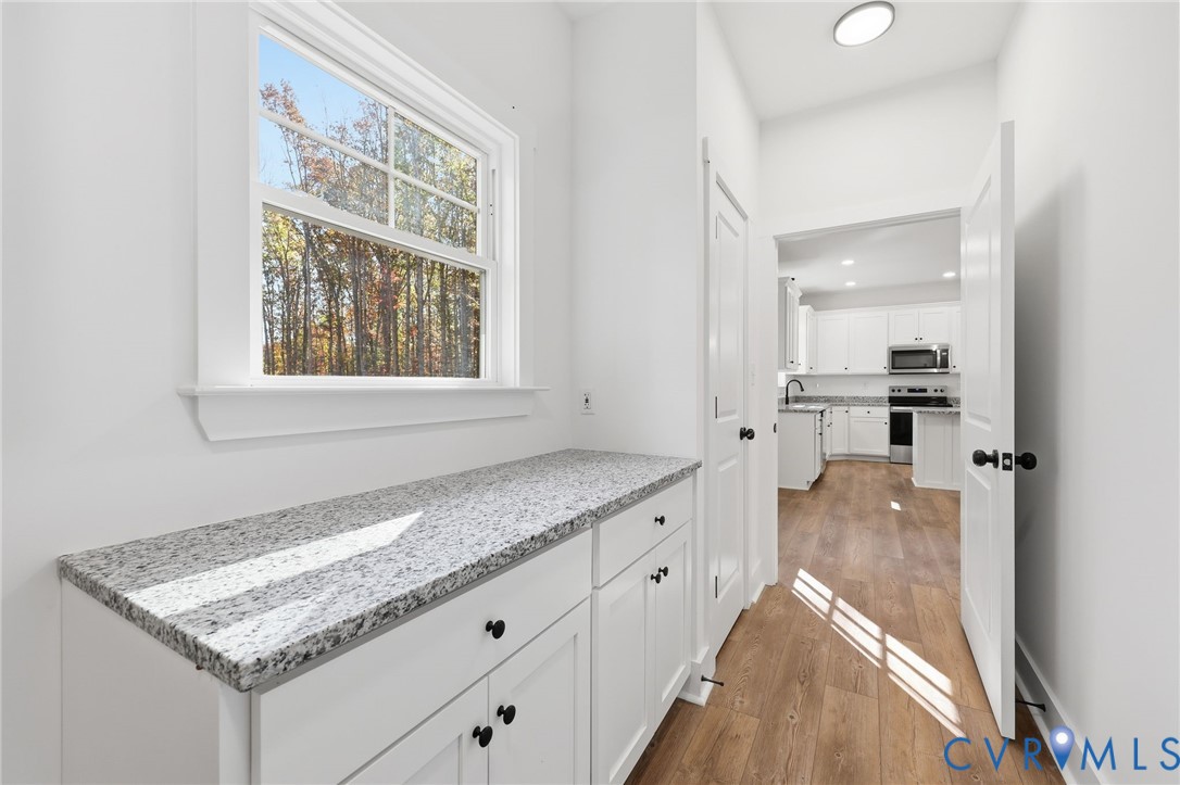 5888 Cartersville Road New Canton, VA 23123 - Photo 28 of 33 a view of a kitchen cabinets counter space and windows