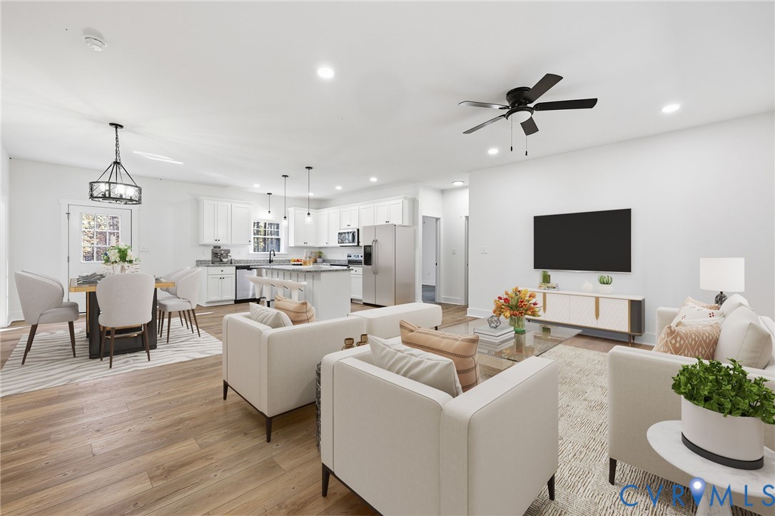 5888 Cartersville Road New Canton, VA 23123 - Photo 3 of 33 a living room with furniture and a flat screen tv