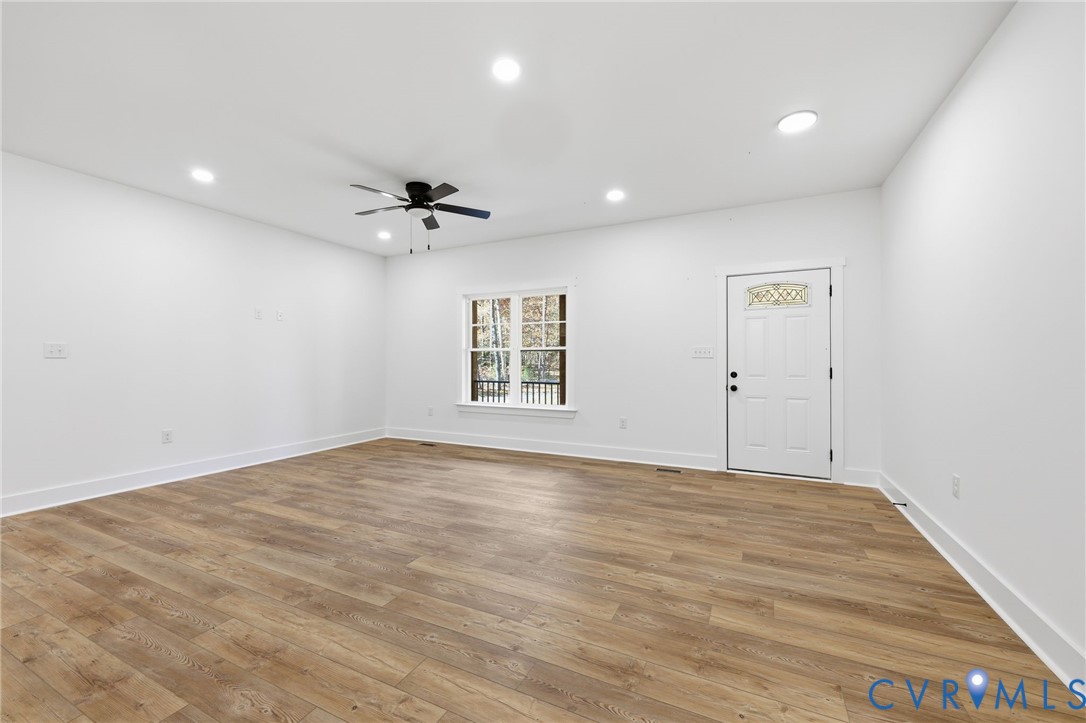 5888 Cartersville Road New Canton, VA 23123 - Photo 4 of 33 wooden floor in an empty room with a window