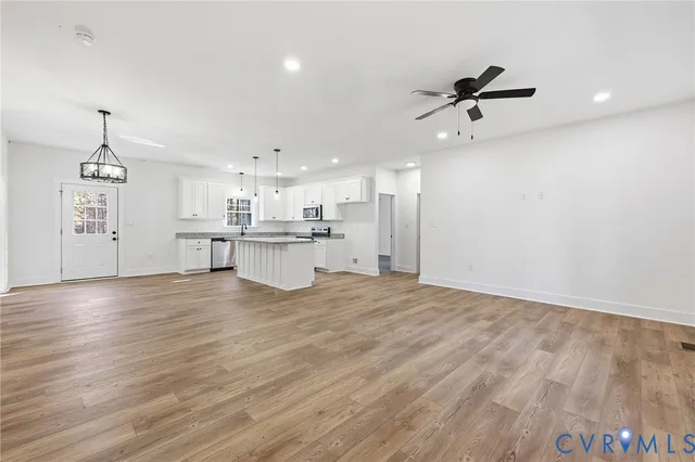 a view of a kitchen with a dishwasher and a refrigerator