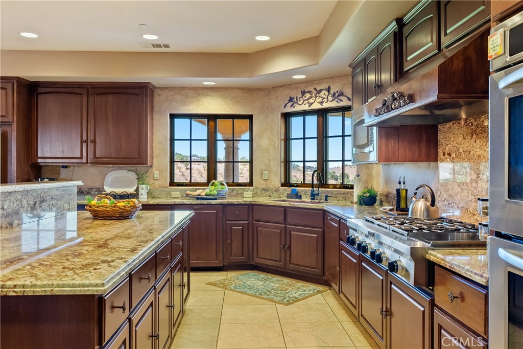 725 Spring Creek Way Templeton, CA 93465 - Photo 12 of 70 a kitchen with stainless steel appliances granite countertop a sink stove and cabinets