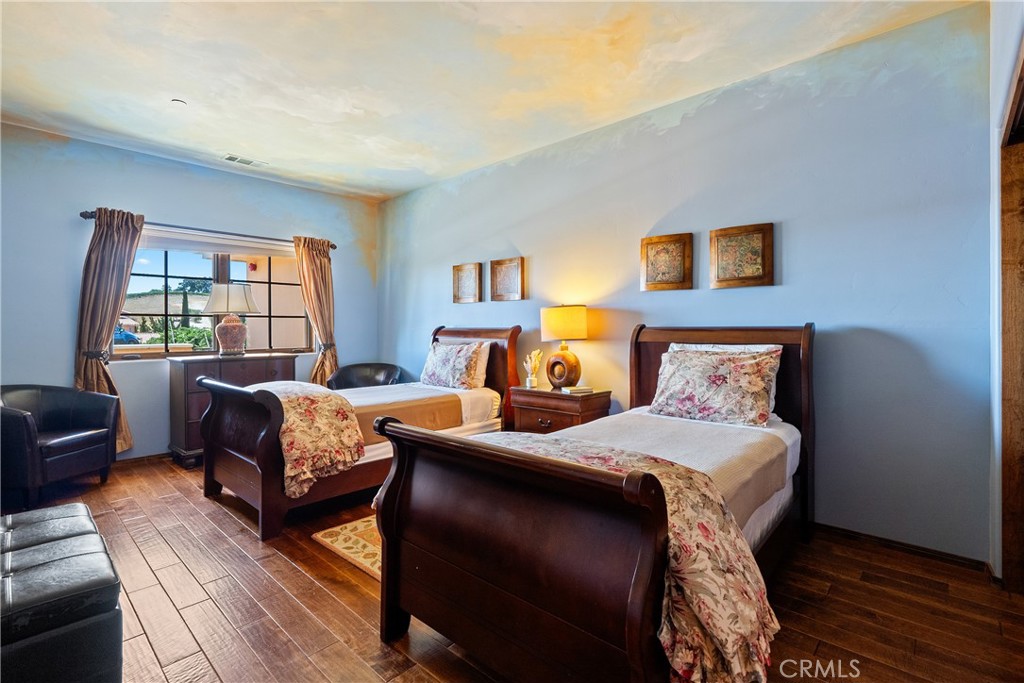 725 Spring Creek Way Templeton, CA 93465 - Photo 28 of 70 a bedroom with a bed and a couch next to a window