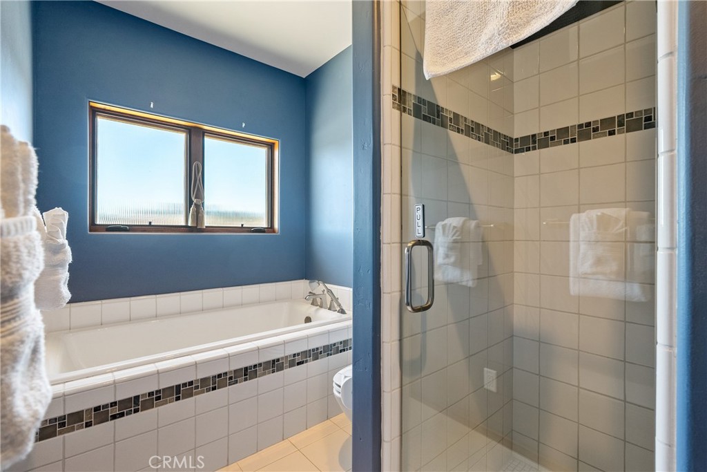 725 Spring Creek Way Templeton, CA 93465 - Photo 31 of 70 a bathroom with a tub and a shower