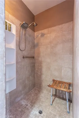 a view of an outdoor space with furniture and city view